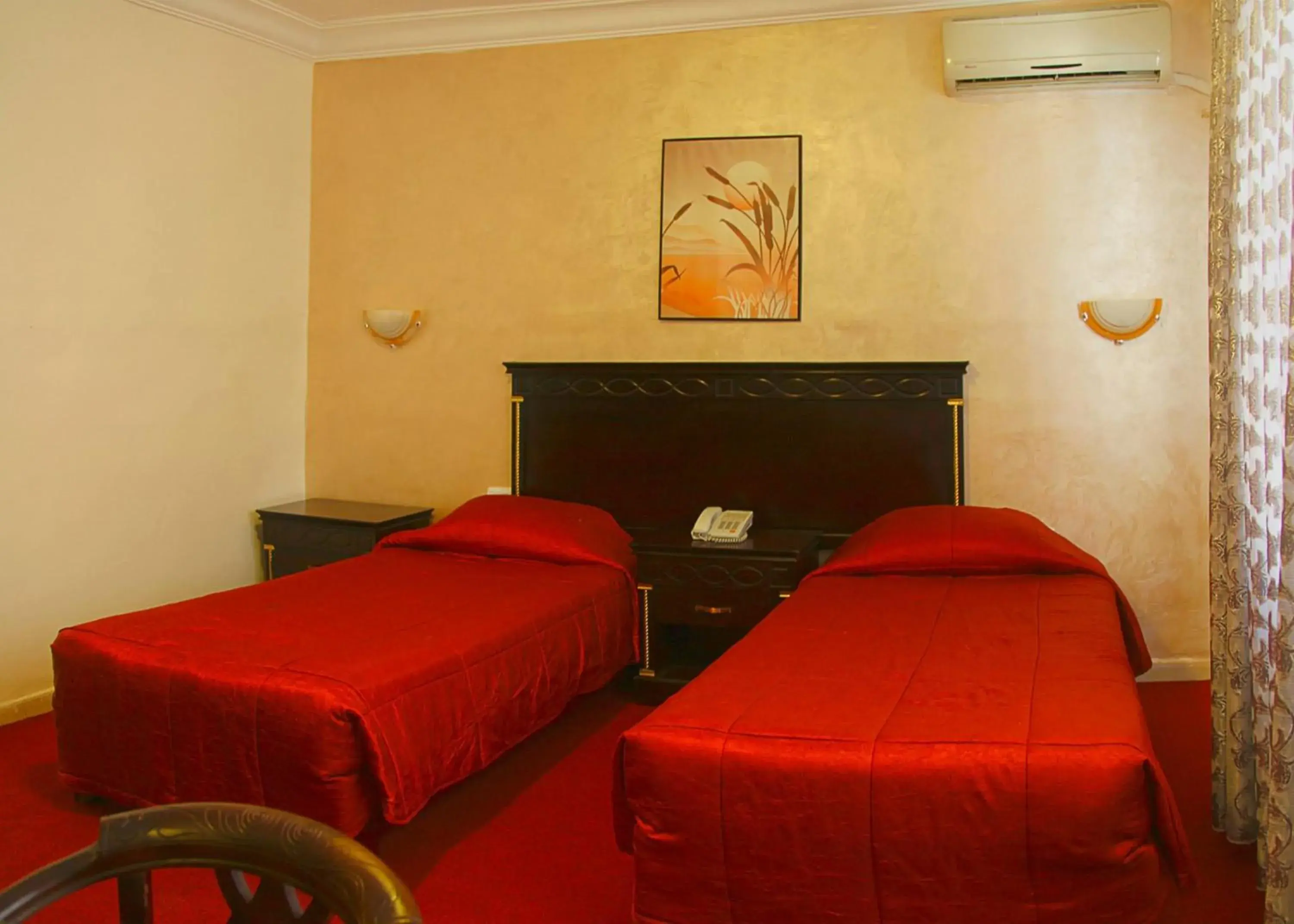 Bed in Gardens Hotel Amman