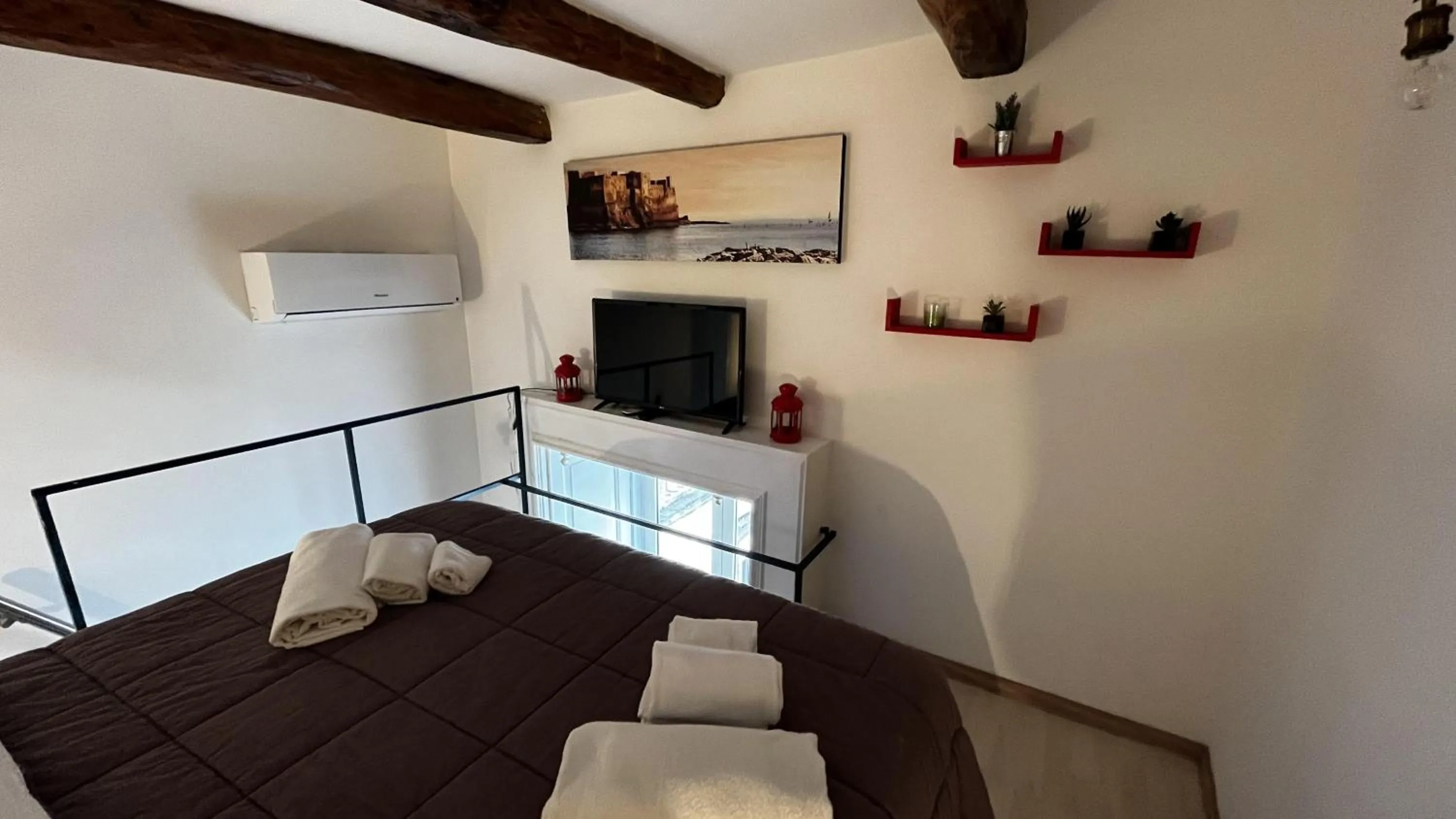 Bedroom in Palazzo della Loggia B&B