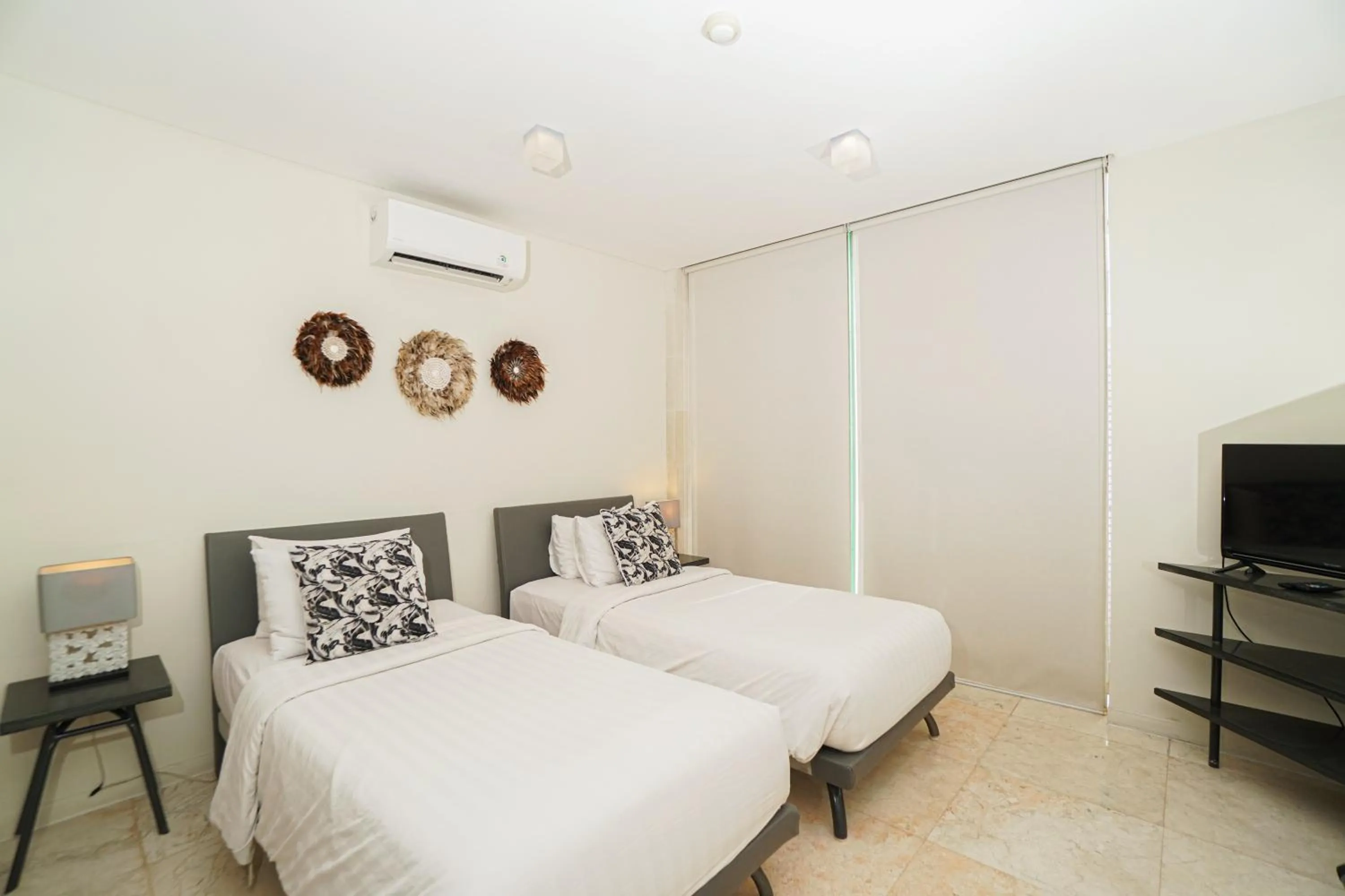 Bed in FuramaXclusive Ocean Beach Seminyak Bali