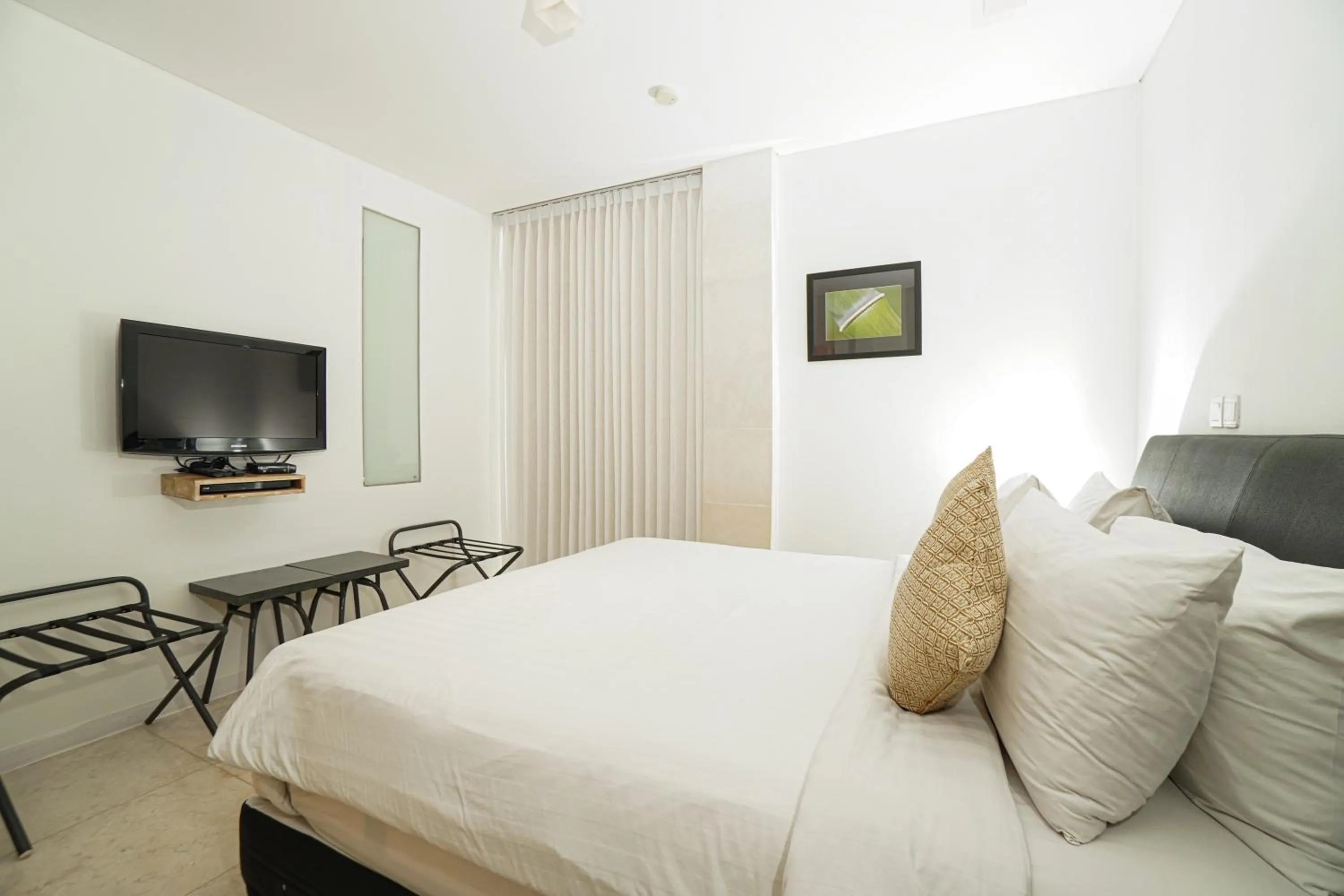 Bed in FuramaXclusive Ocean Beach Seminyak Bali