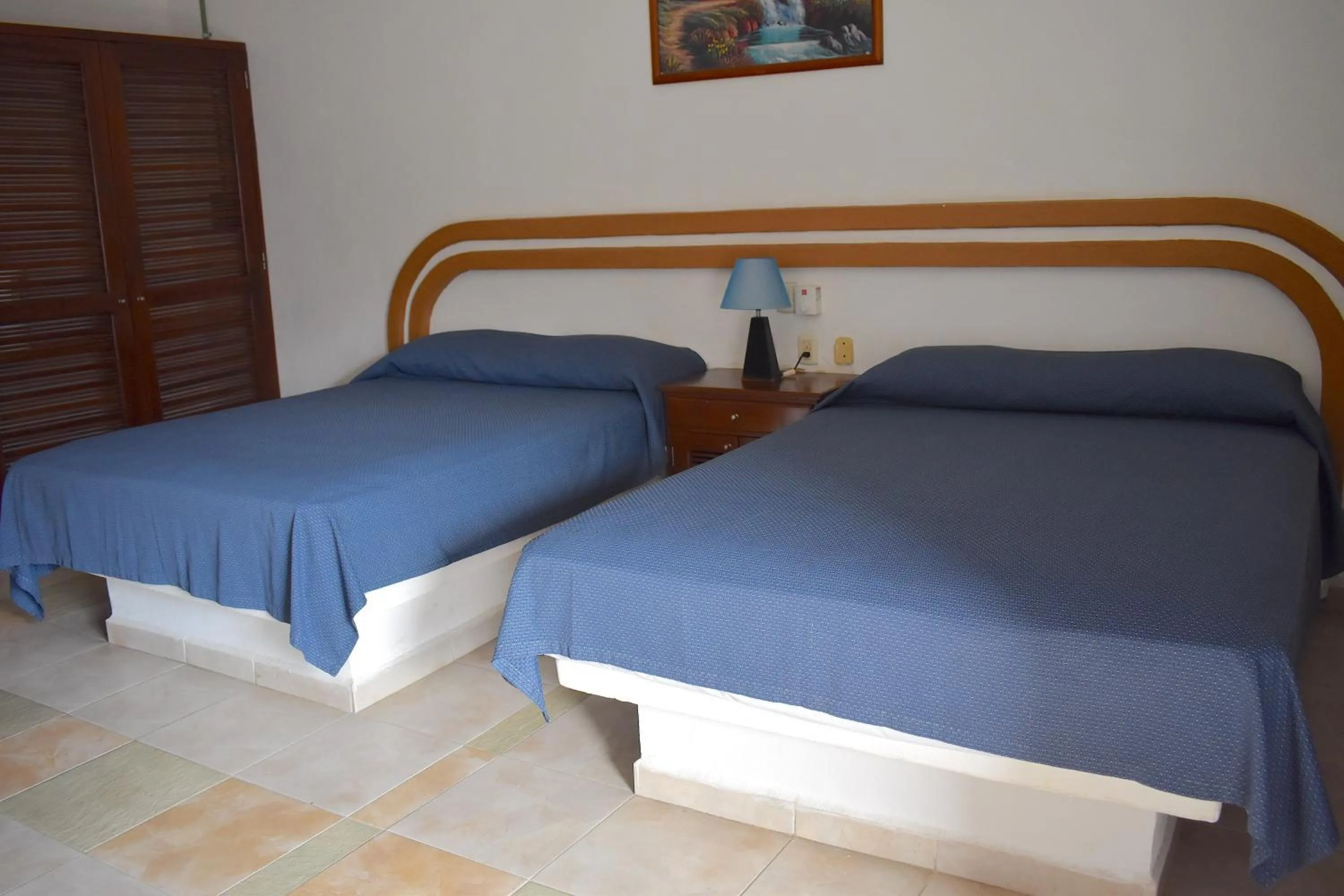 Bed in Plaza Almendros Hotel Isla Mujeres