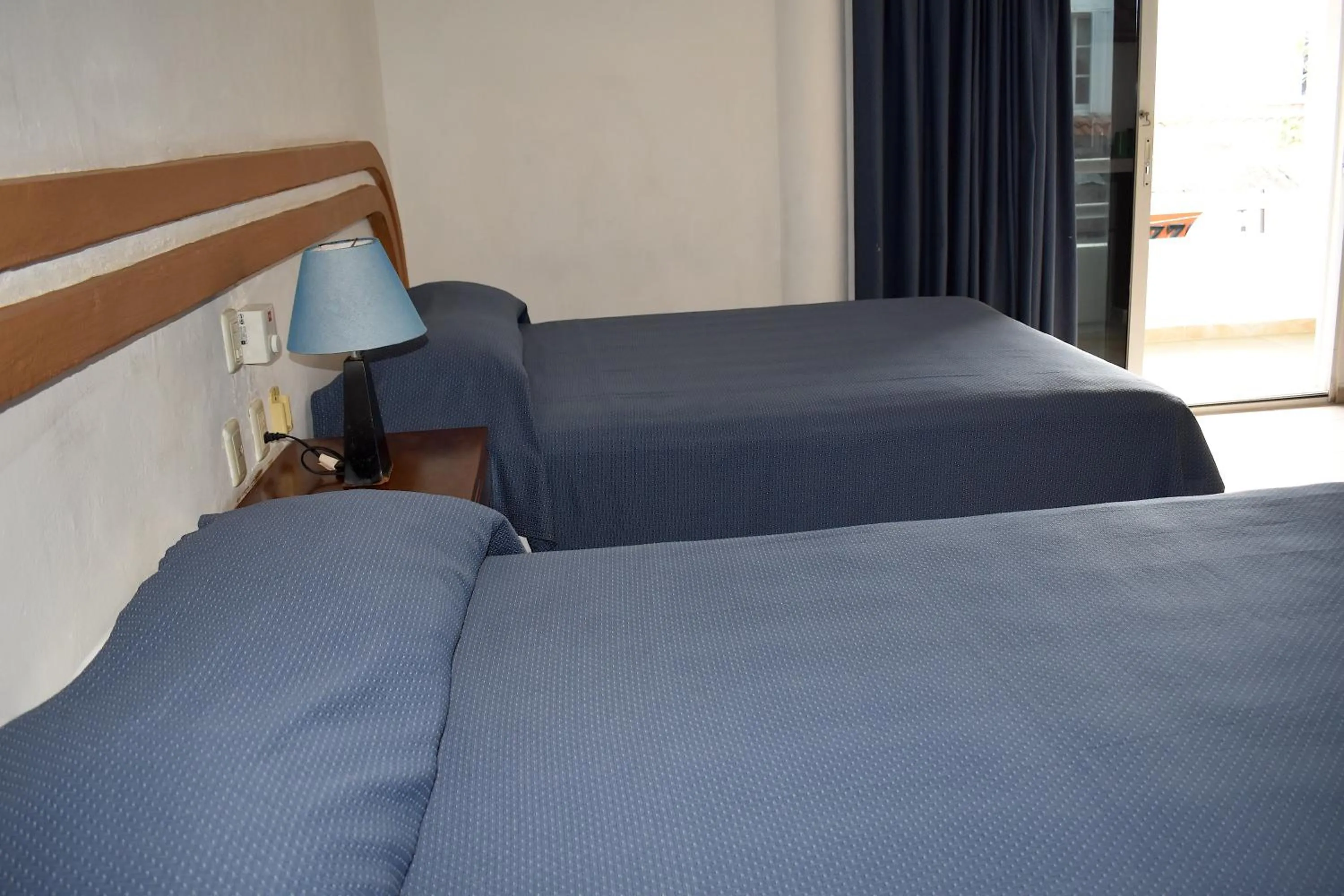 Bed in Plaza Almendros Hotel Isla Mujeres