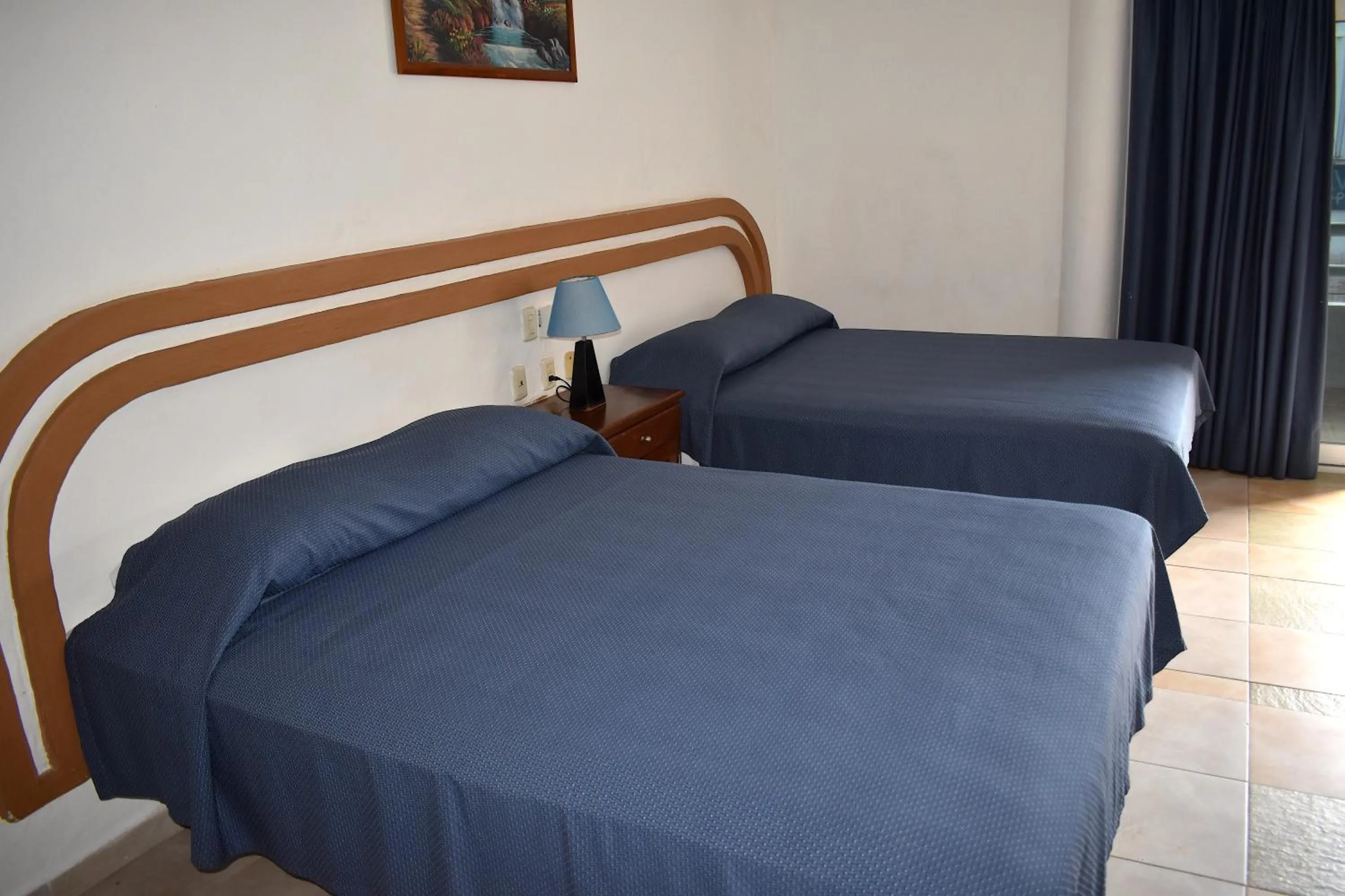 Bed in Plaza Almendros Hotel Isla Mujeres