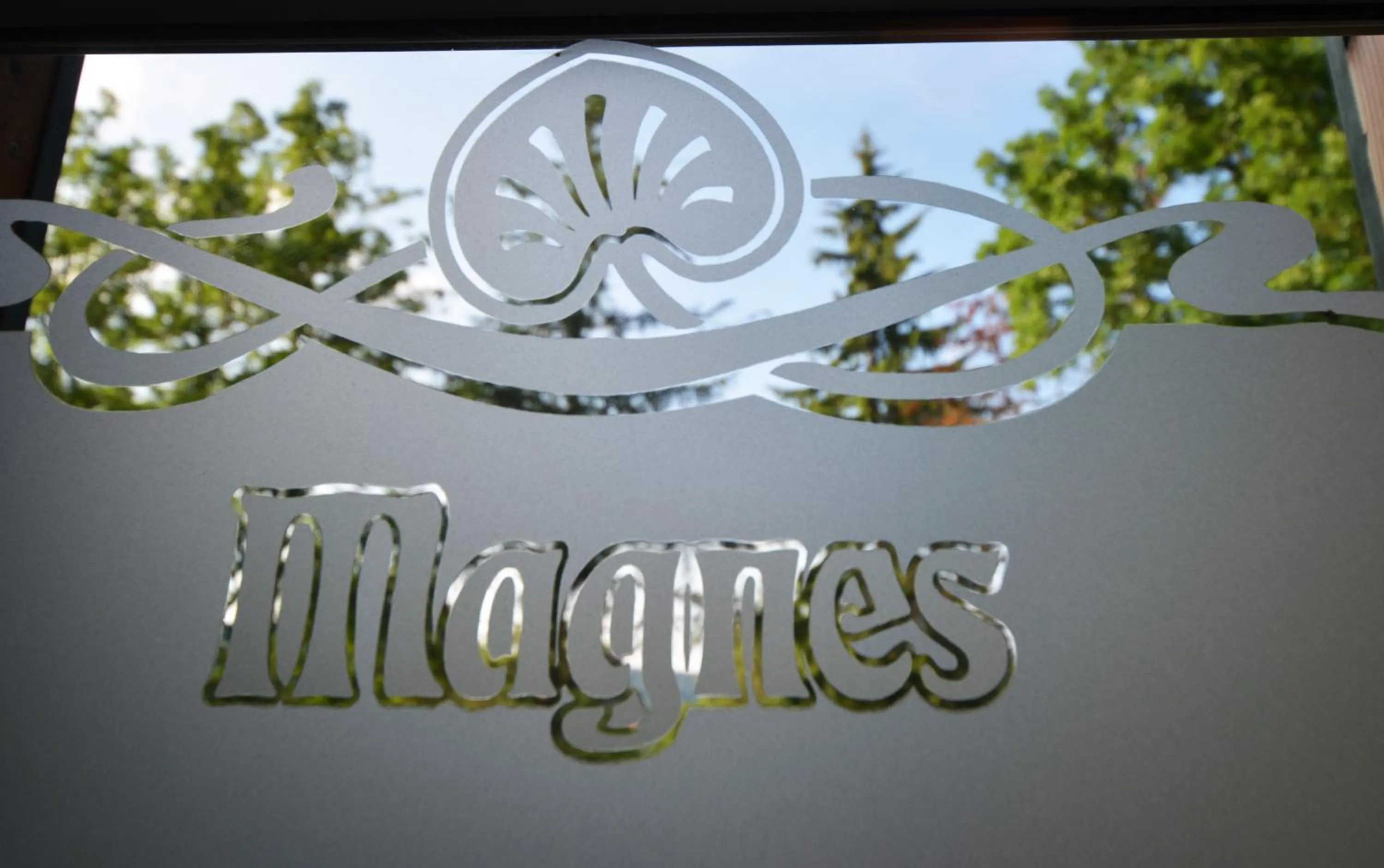 Property logo or sign in Hotel Magnes