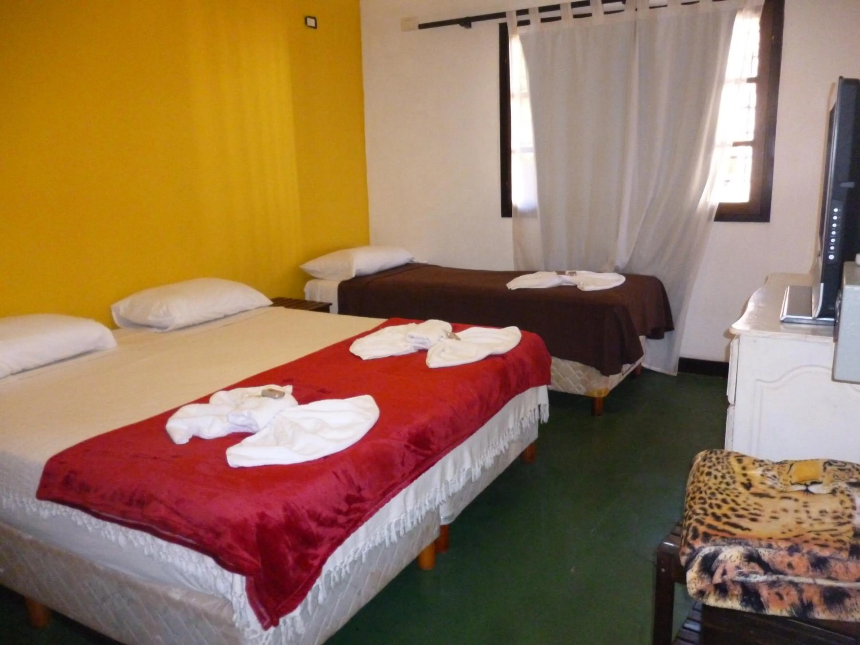 Bed in Passaros Suite Hotel