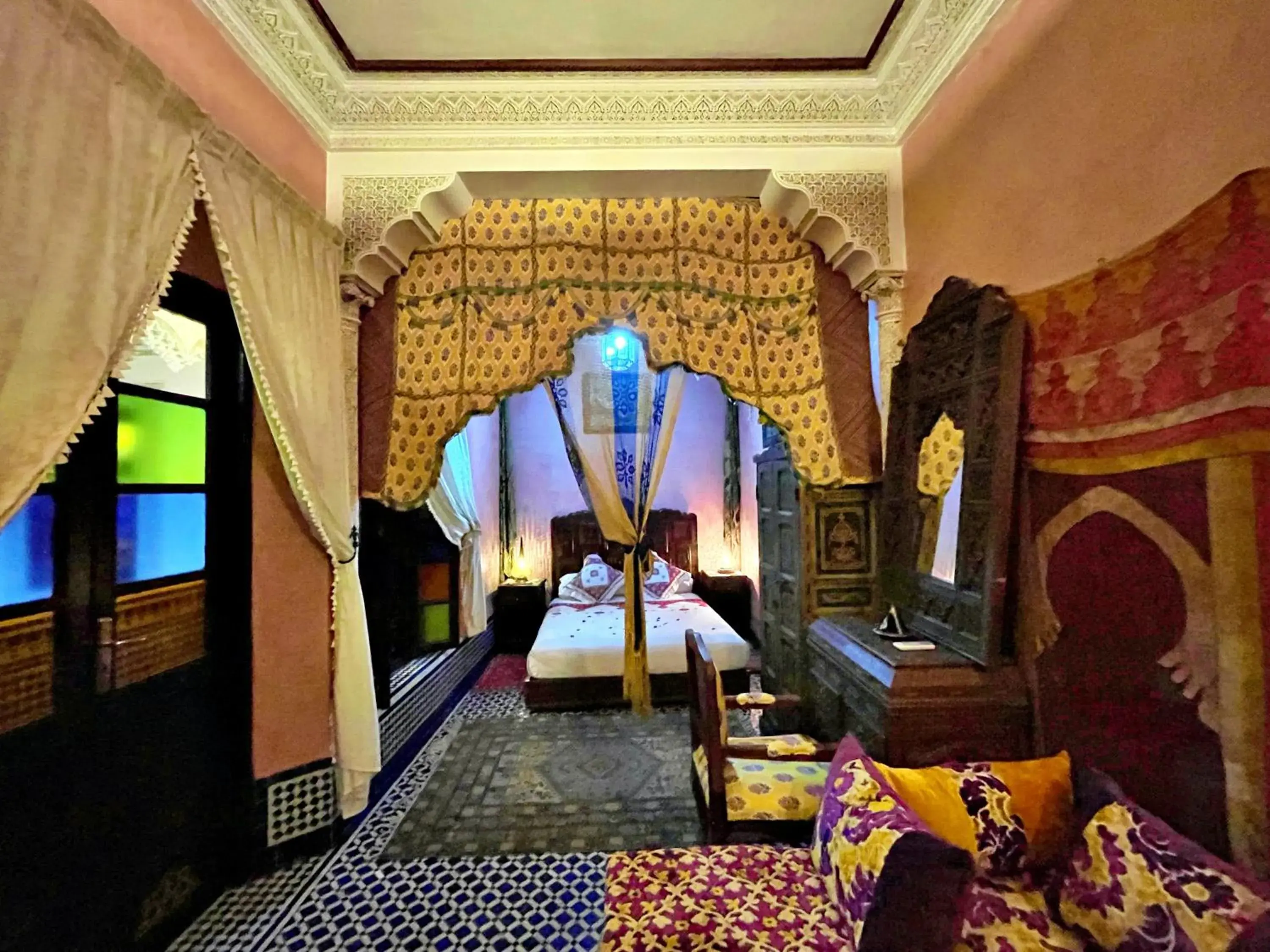 Seating area, Bed in Riad Dar Guennoun - Luxury Suites in the Heart of Fes Seating area, Bed in Riad Dar Guennoun - Luxury Suites in the Heart of Fes