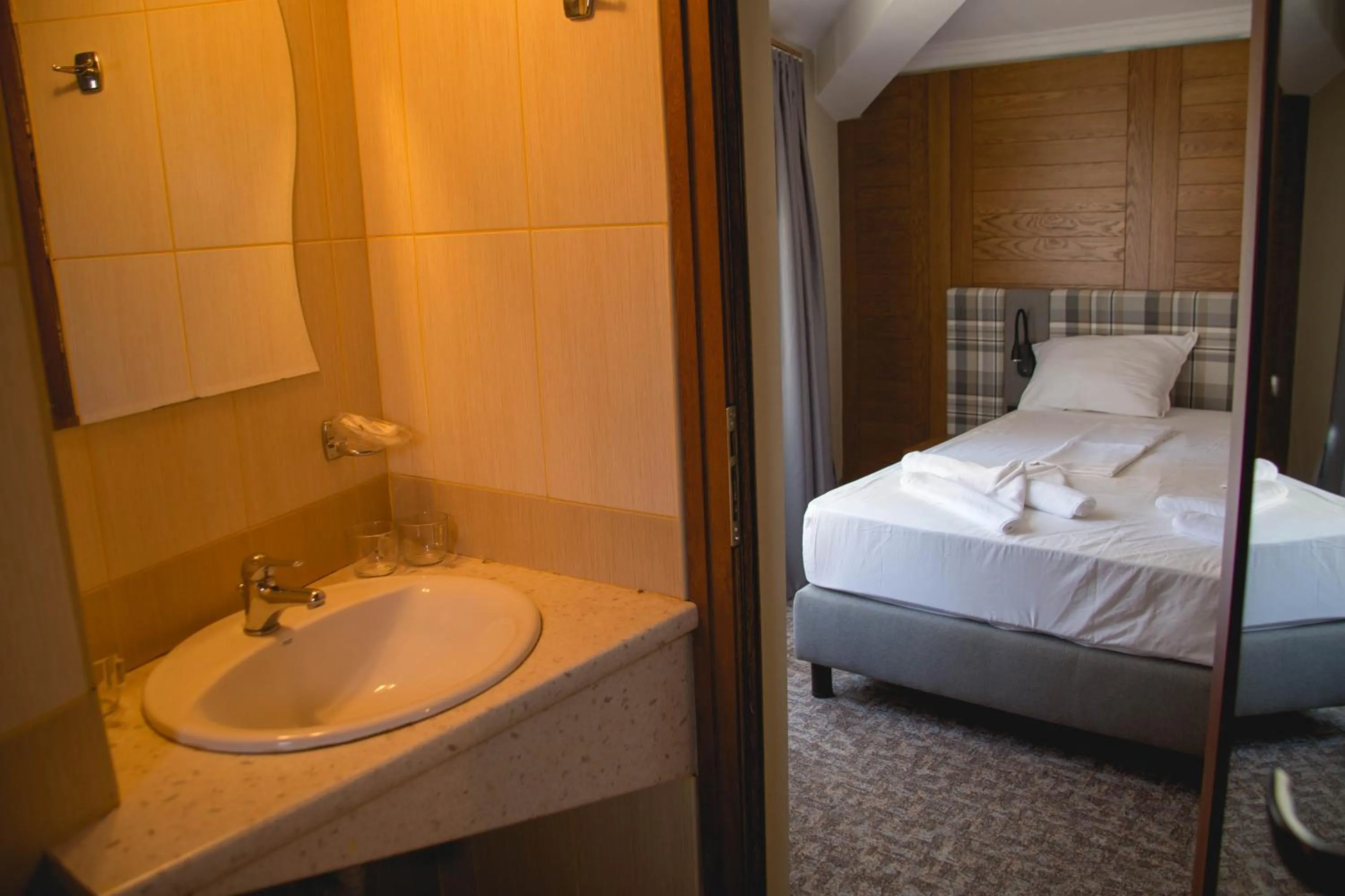 Bed in Prince Cyril Hotel