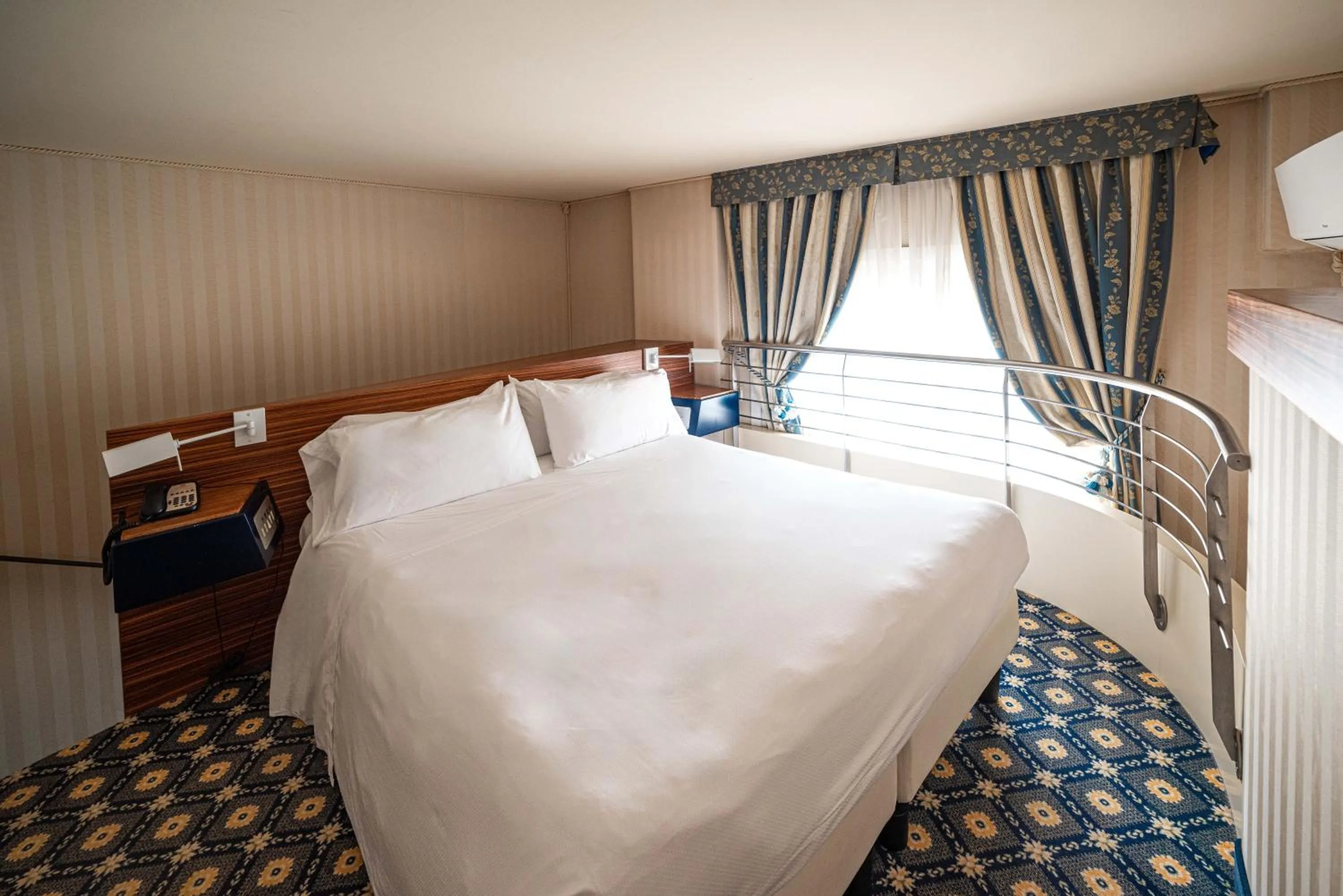 Bed in Phi Hotel Principe