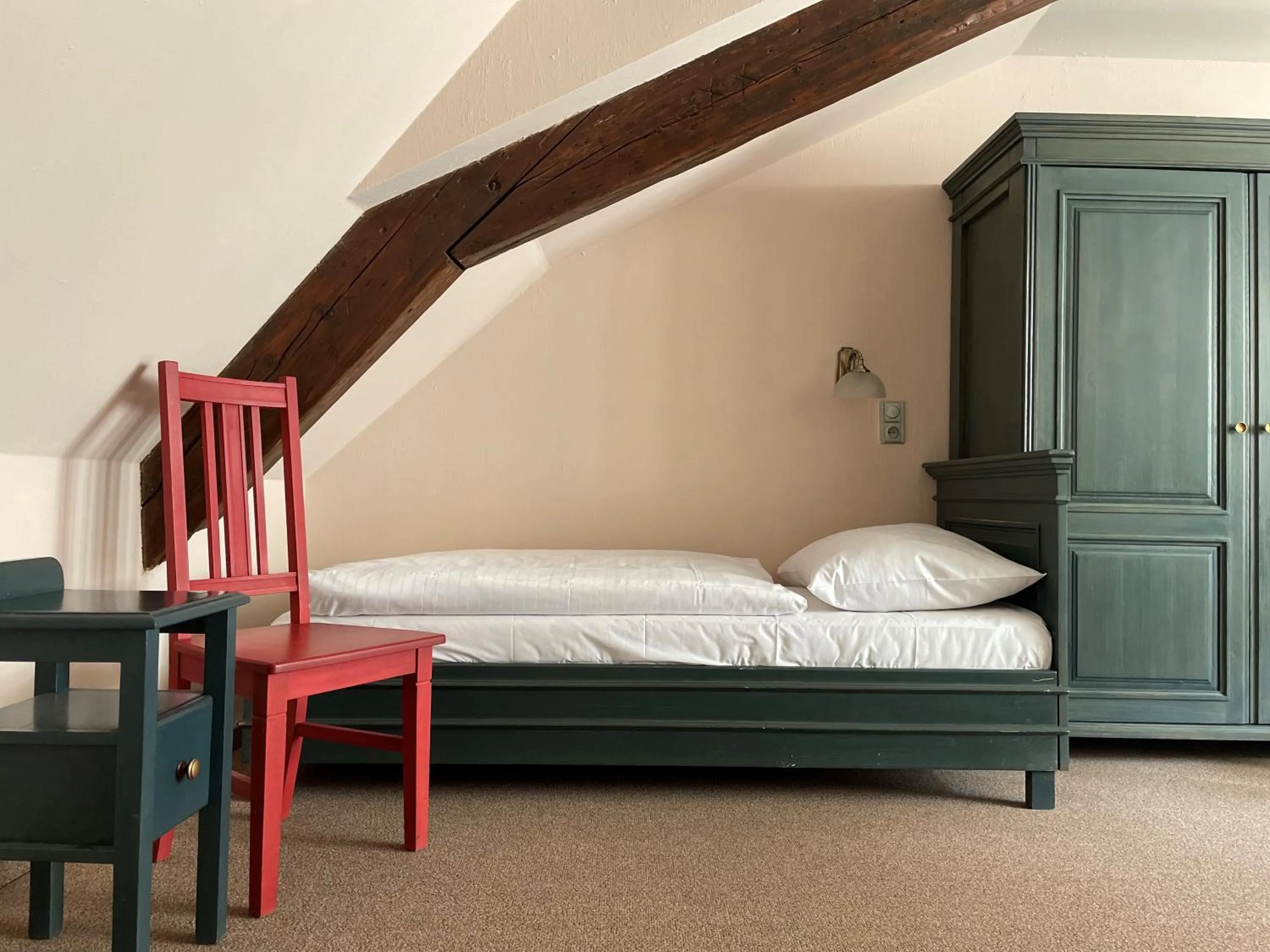 Bed in U Cervene zidle - Red Chair Hotel