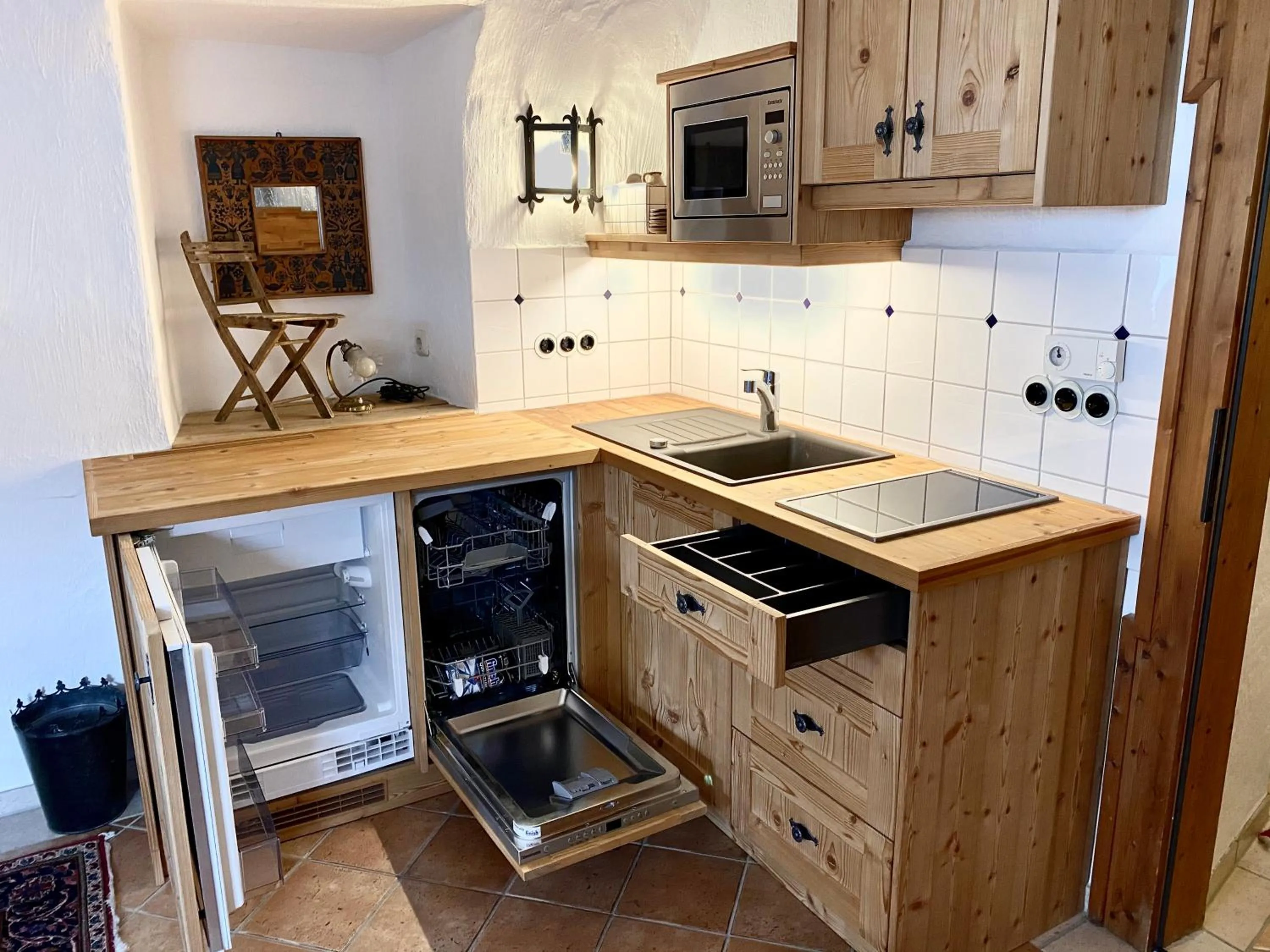 Kitchen or kitchenette in Aparthotel Schloss Thannegg