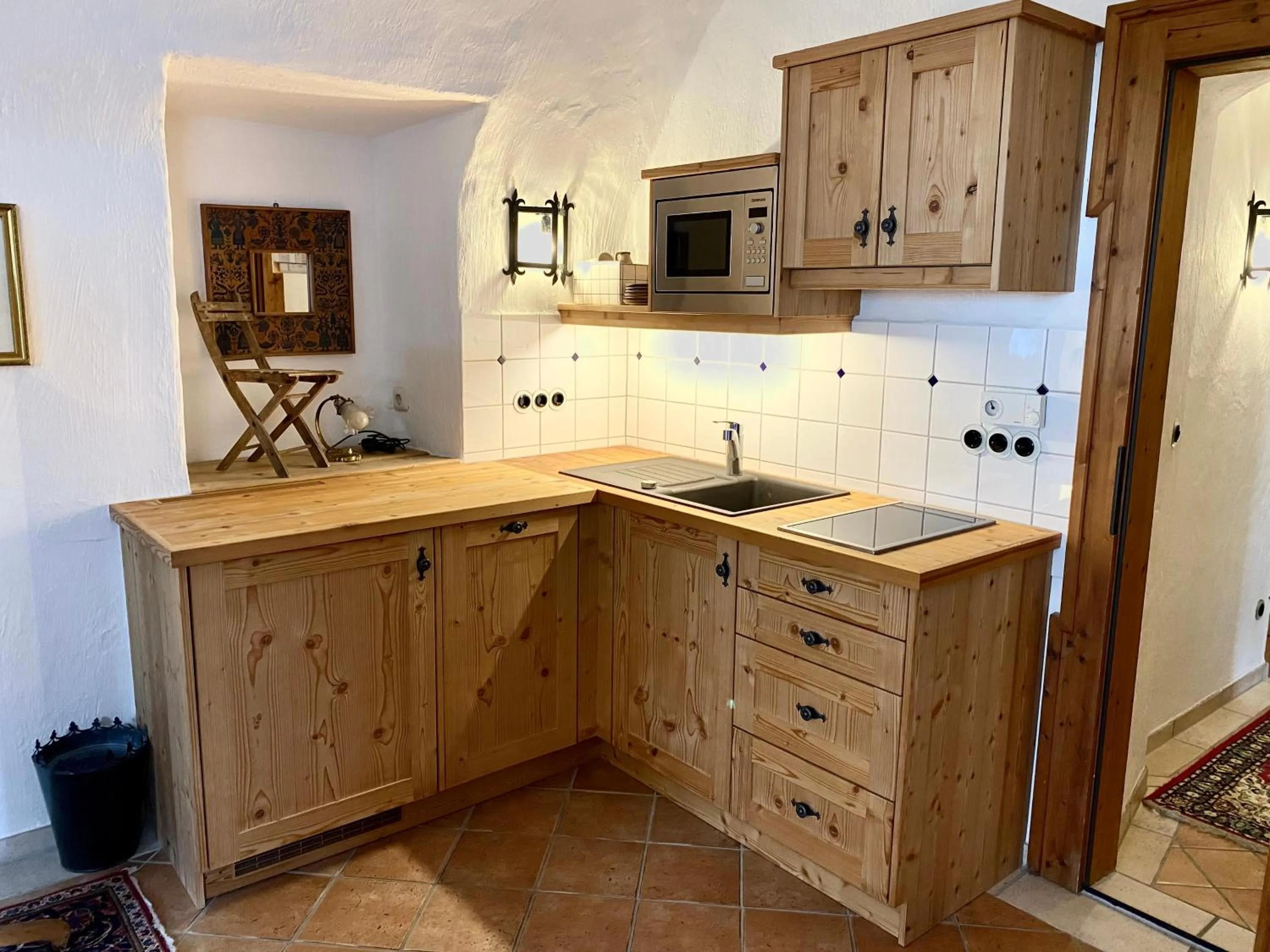 Kitchen or kitchenette in Aparthotel Schloss Thannegg