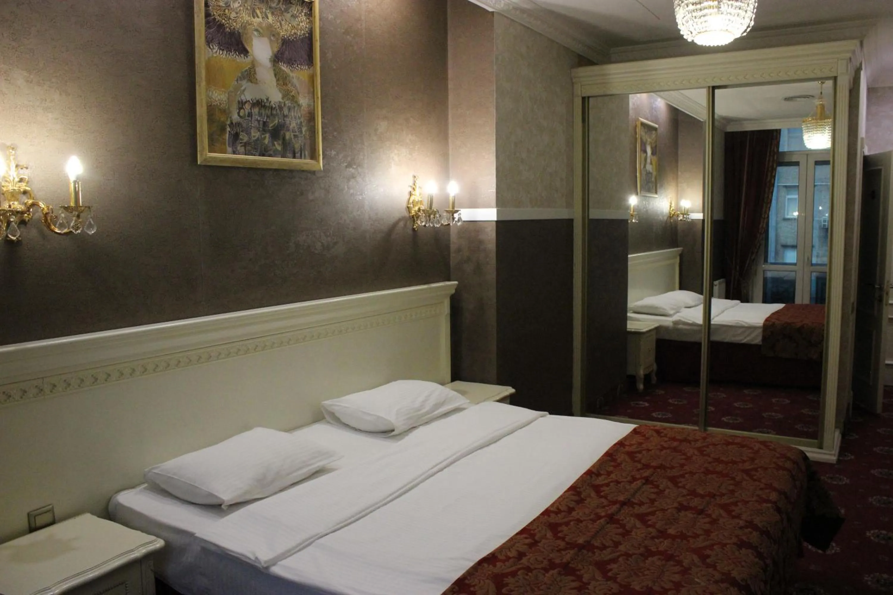 Bed in De Paris Hotel