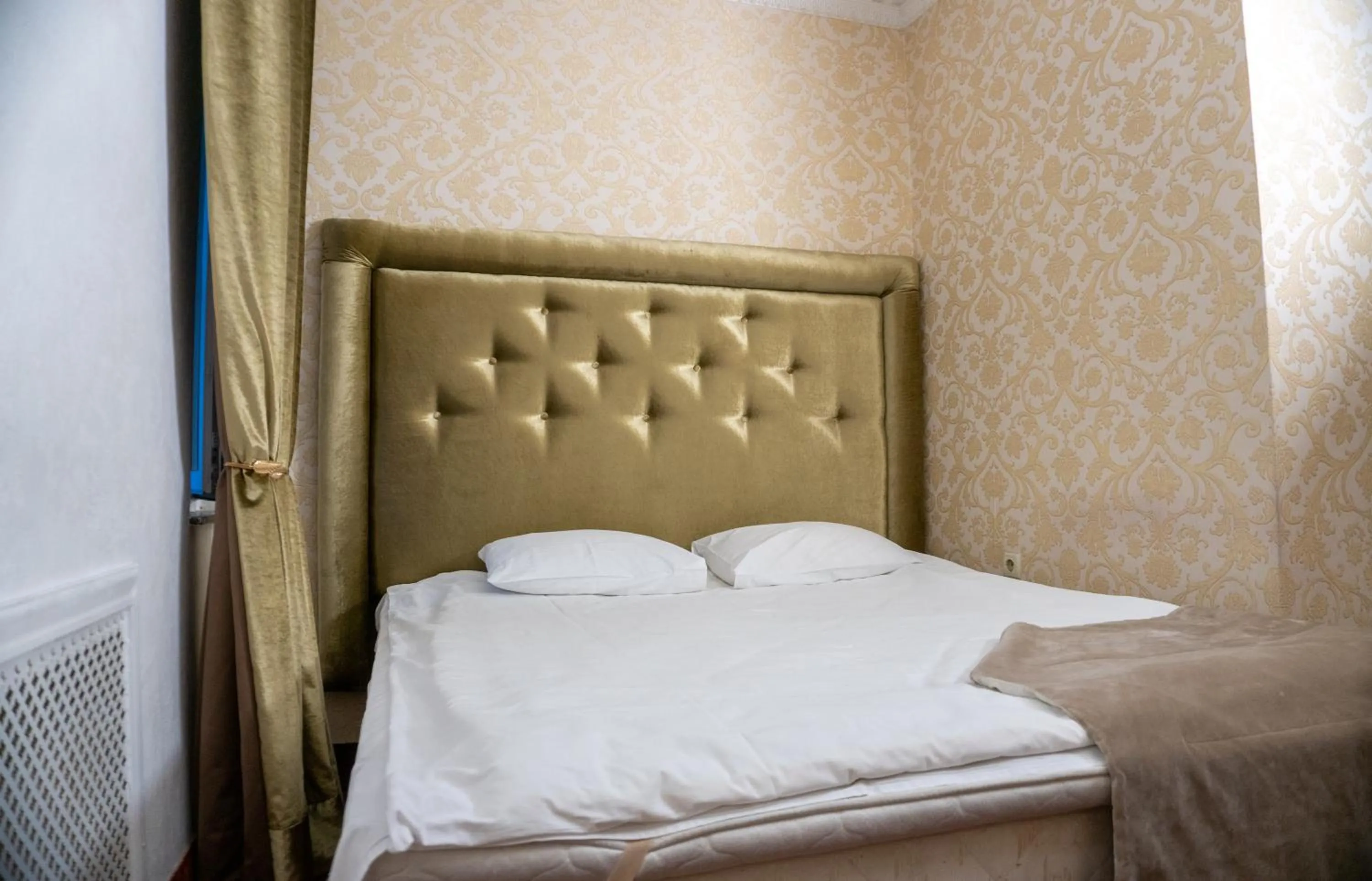 Bed in De Paris Hotel