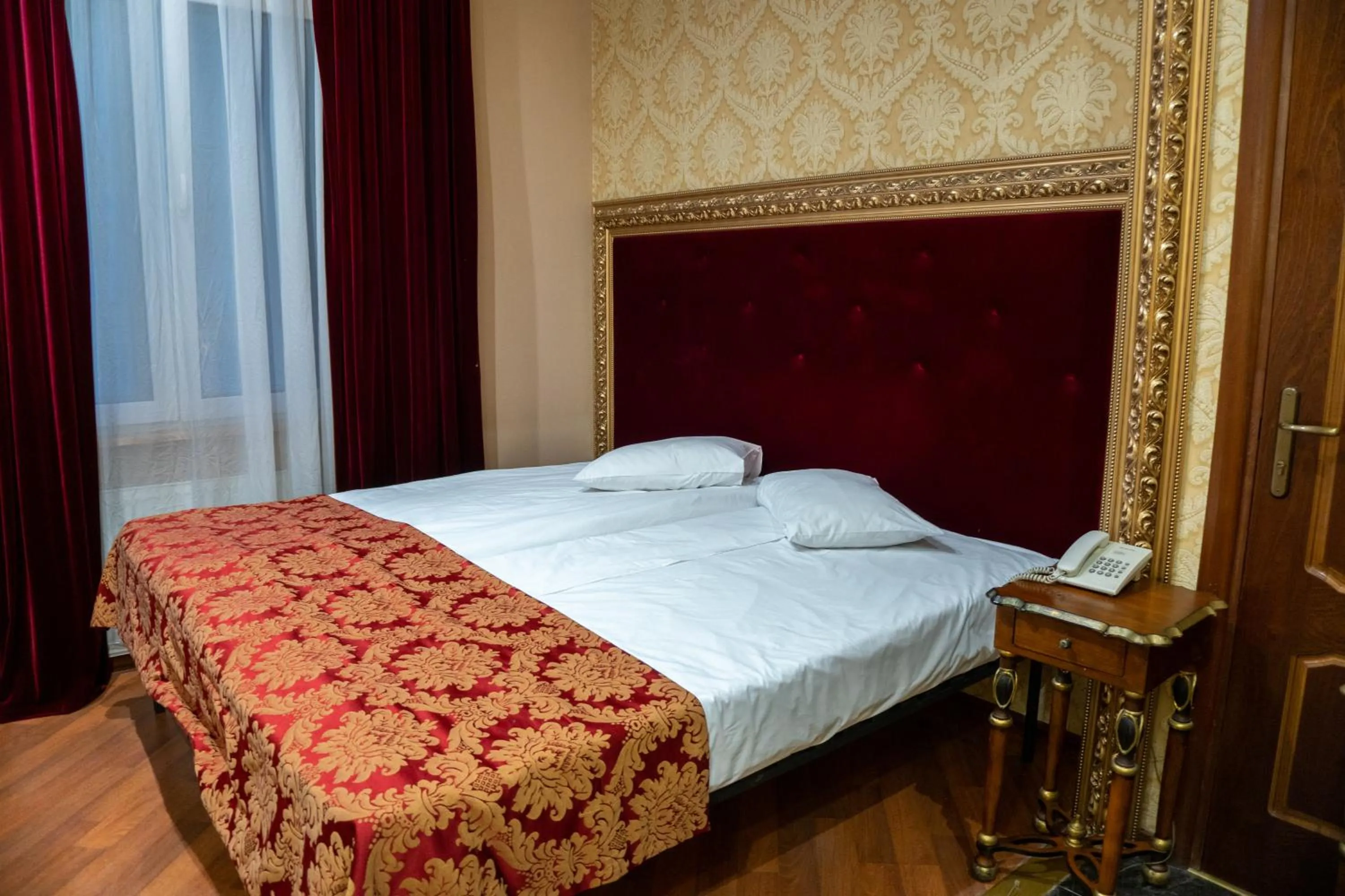Bed in De Paris Hotel
