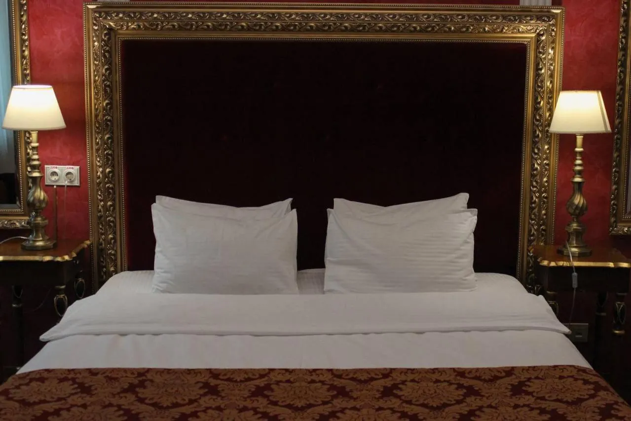 Bed in De Paris Hotel