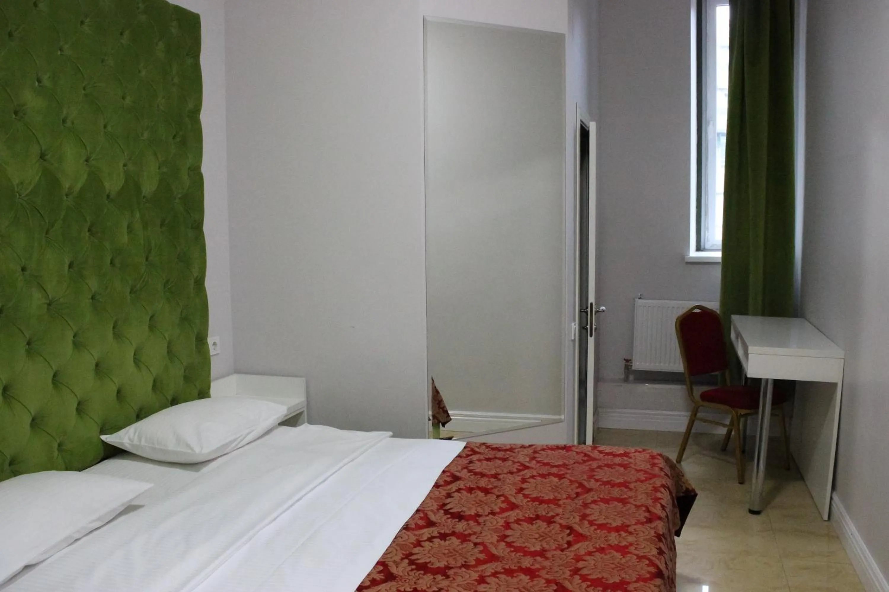 Bed in De Paris Hotel