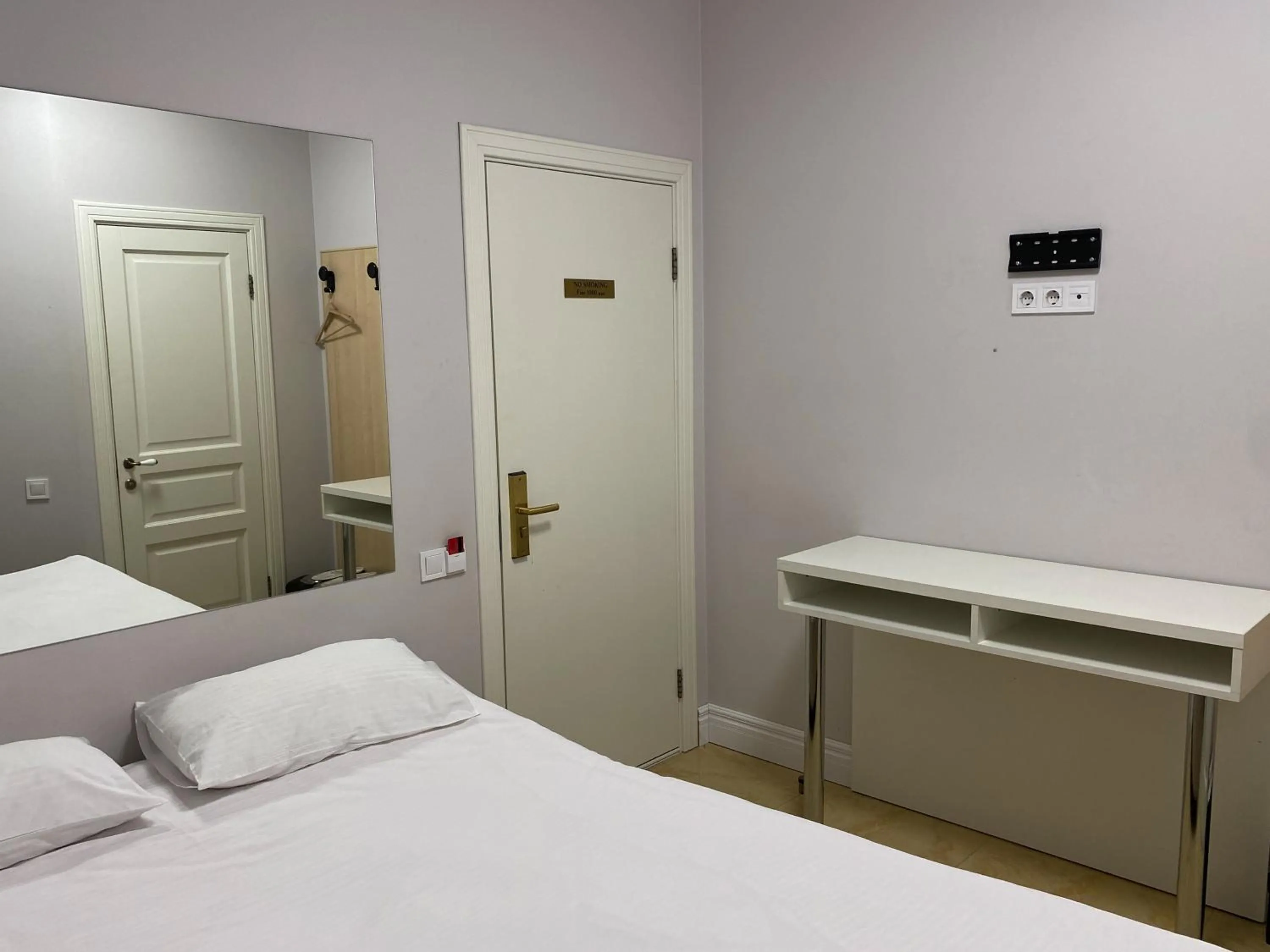 Bed in De Paris Hotel
