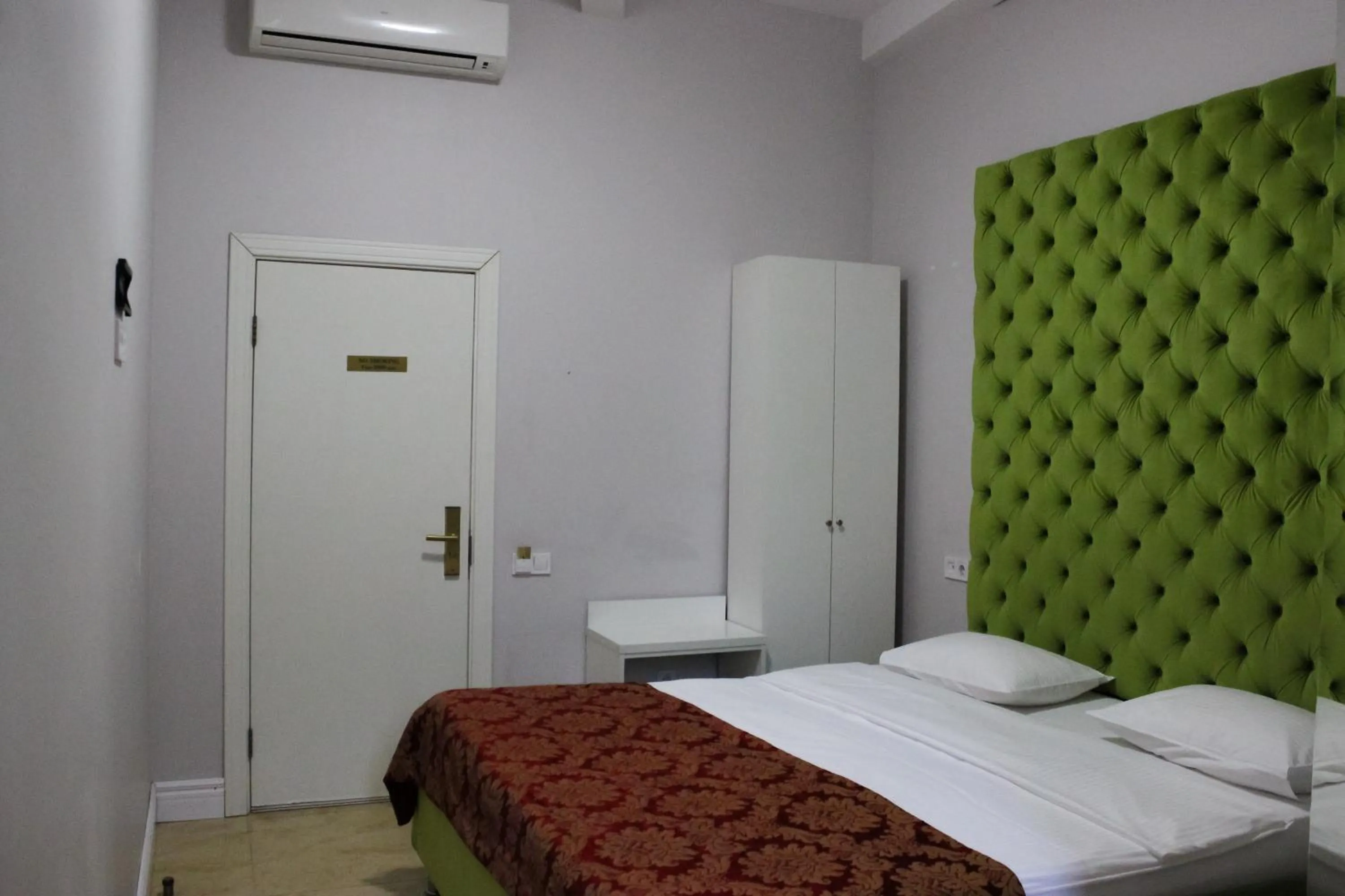 Bed in De Paris Hotel