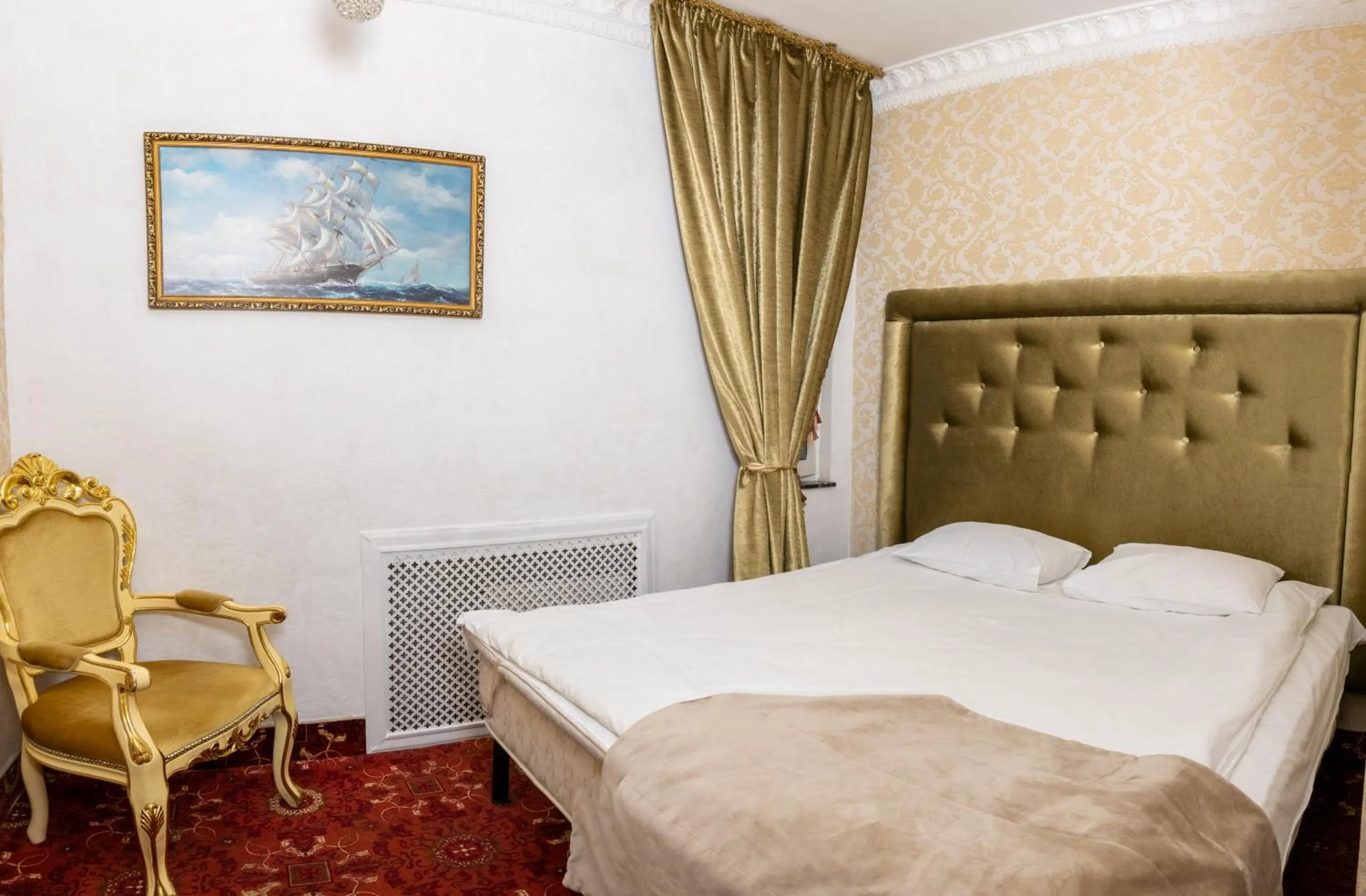 Bed in De Paris Hotel