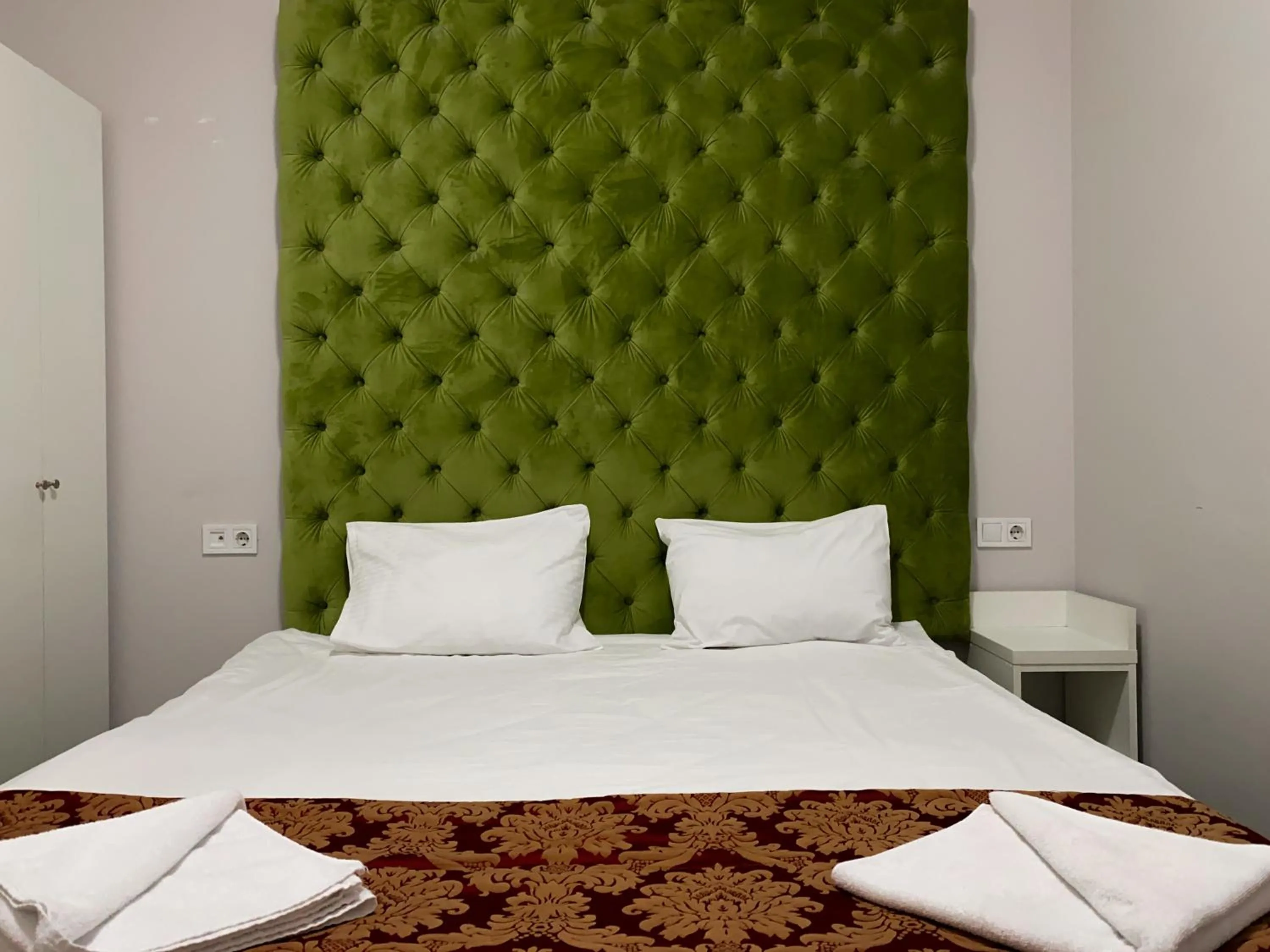 Bed in De Paris Hotel