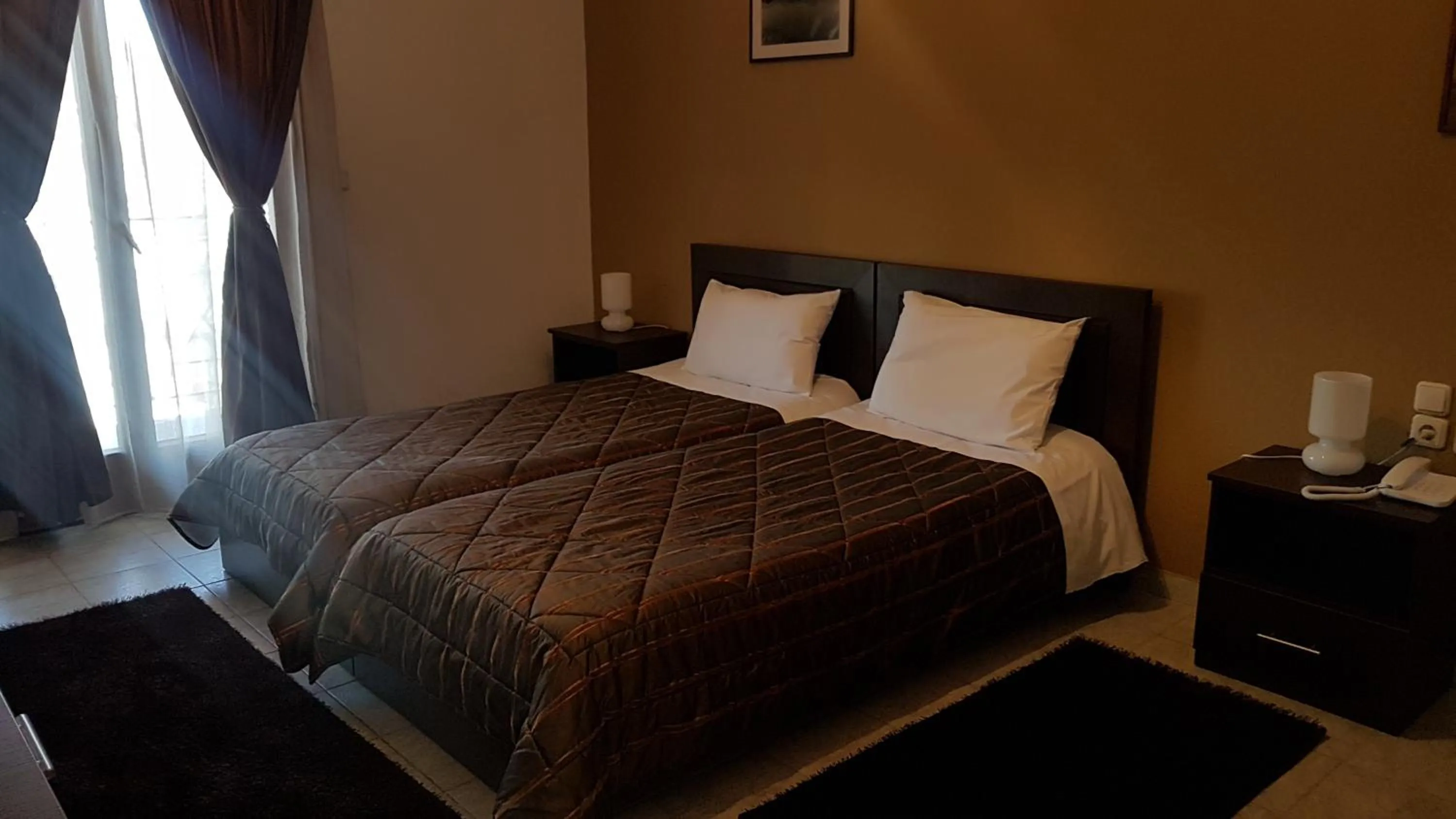 Garden view, Bed in Hotel Odysseas