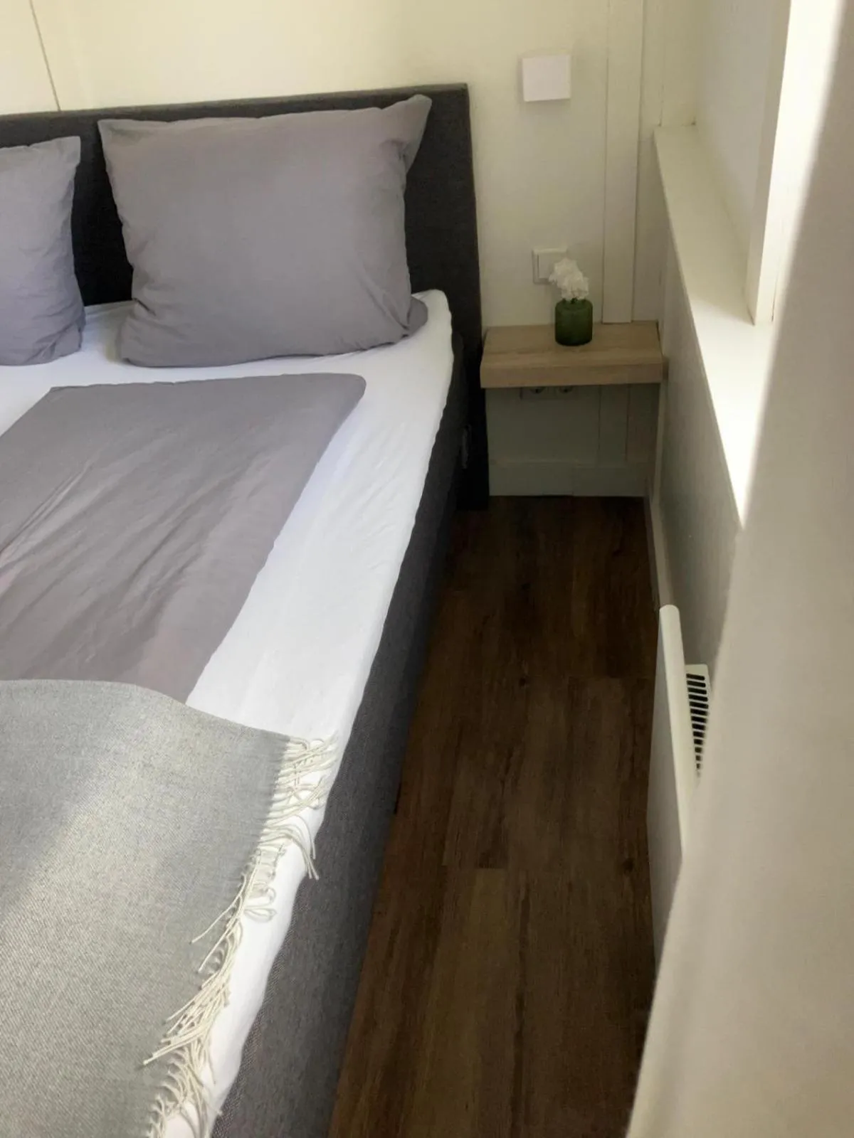 Bed in Die zwei Löwen Ferienwohnungen