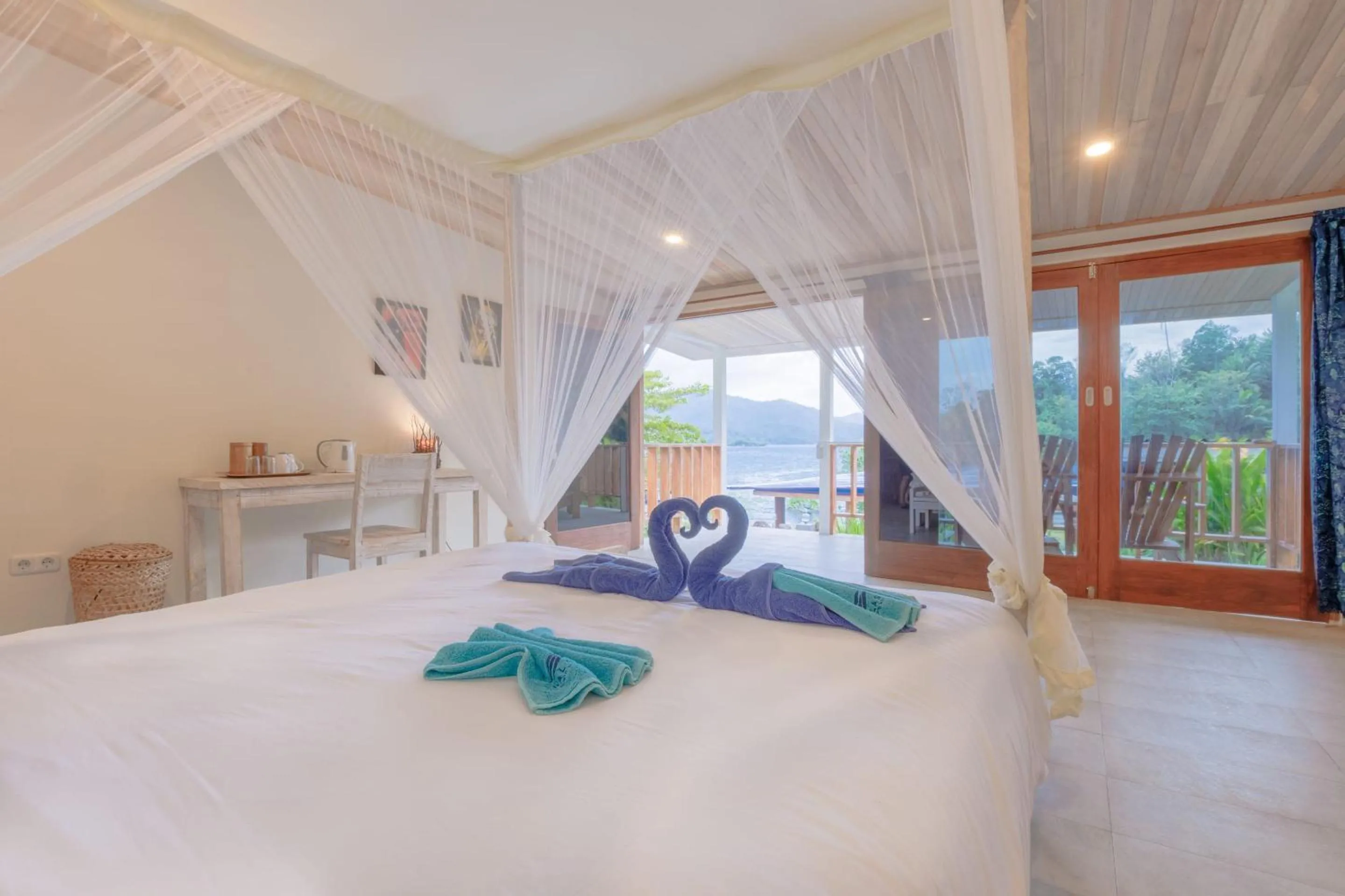Bed in Thalassa Dive Resort Lembeh