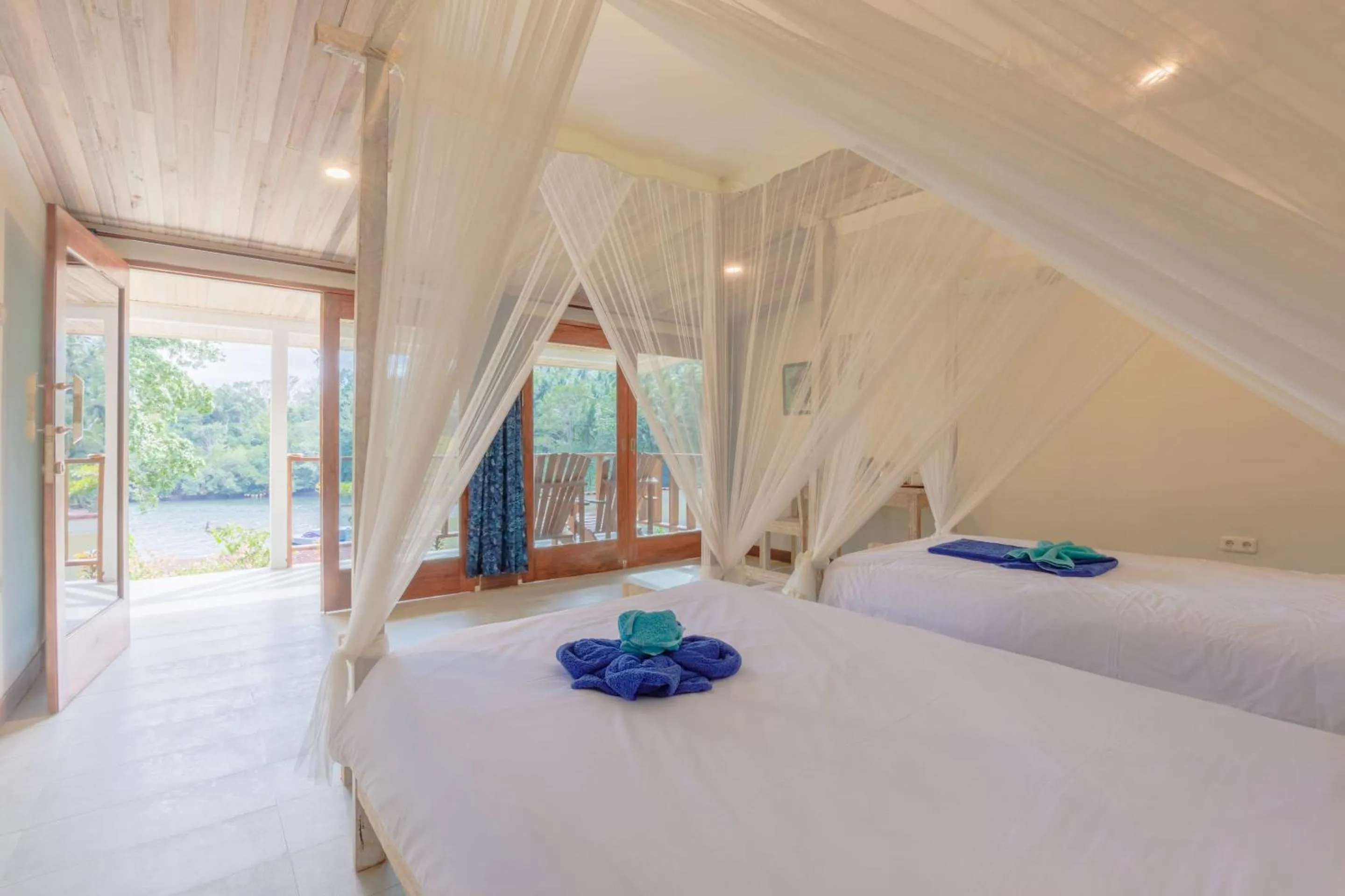Bed in Thalassa Dive Resort Lembeh