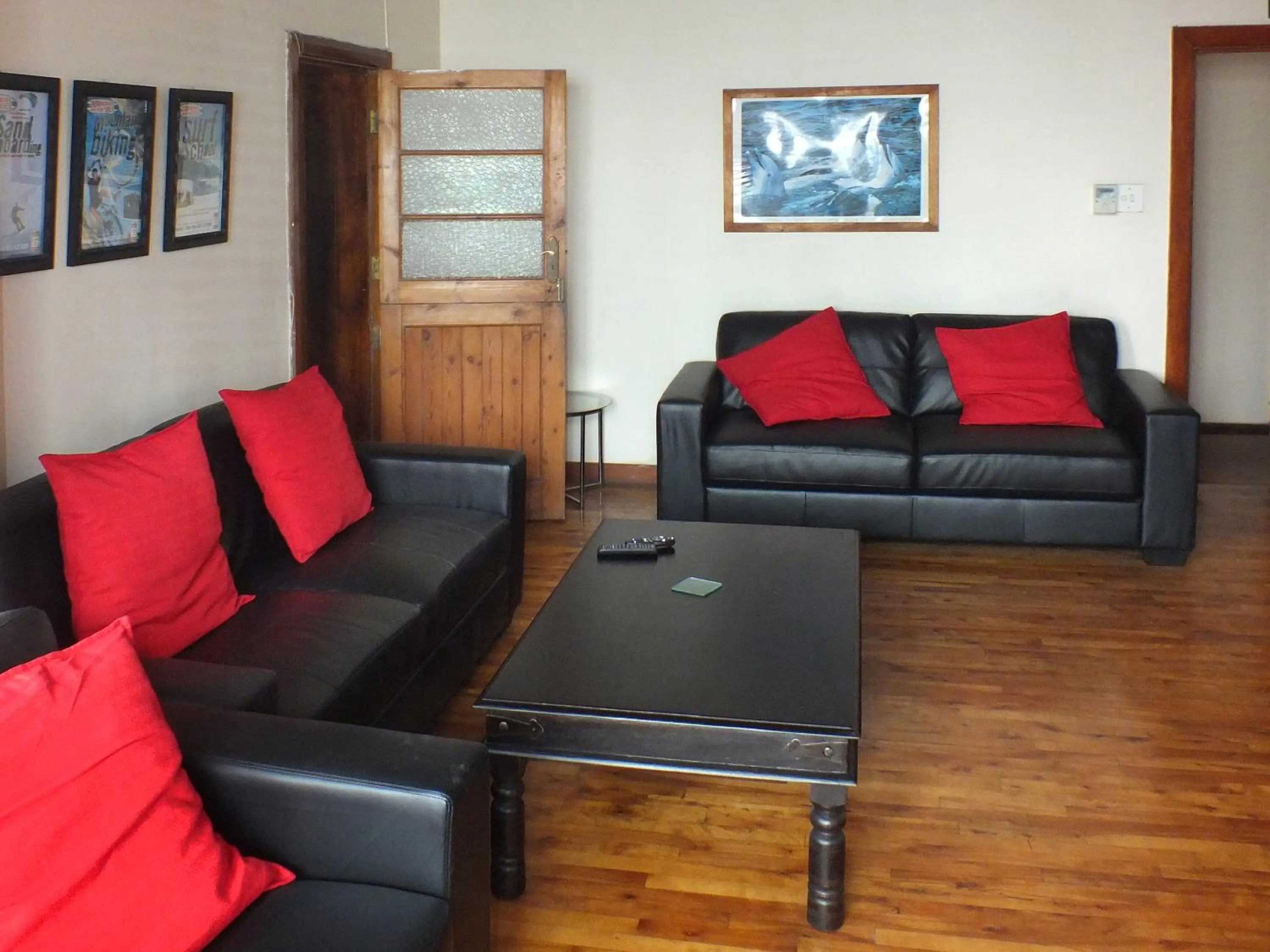 Communal lounge/ TV room in A Sunflower Stop Backpackers