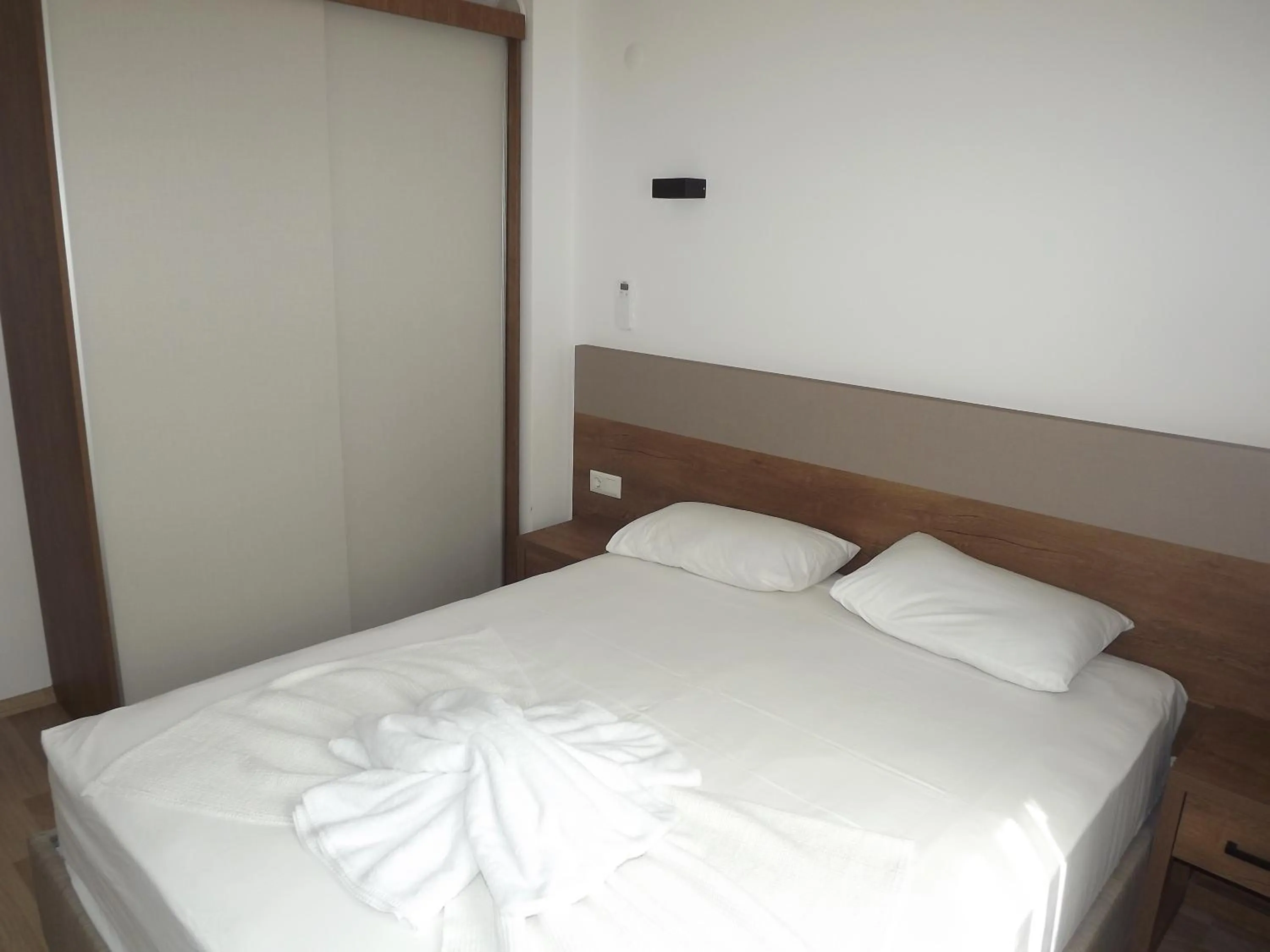 Bed in Opus Apart Hotel