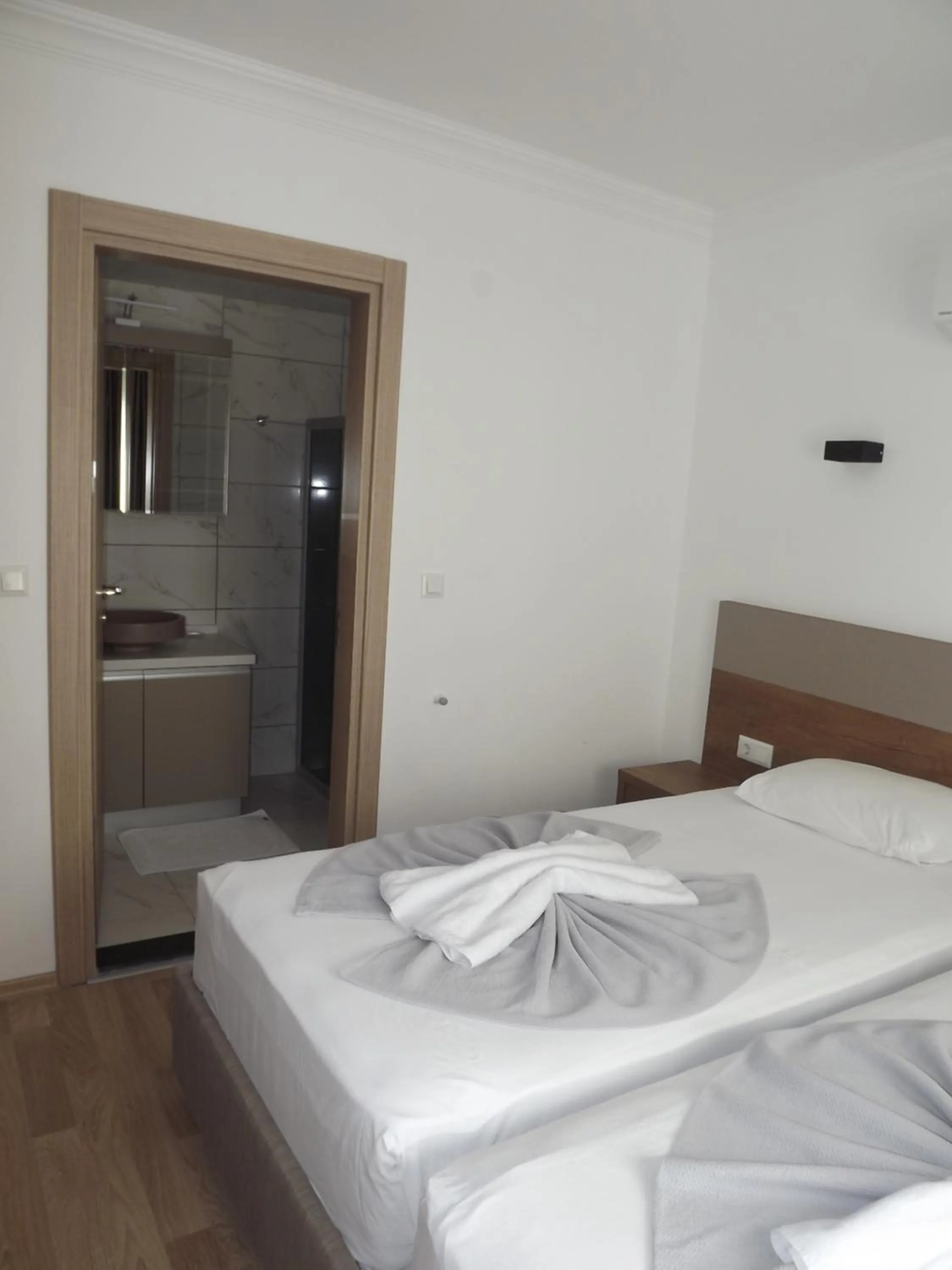 Bed in Opus Apart Hotel