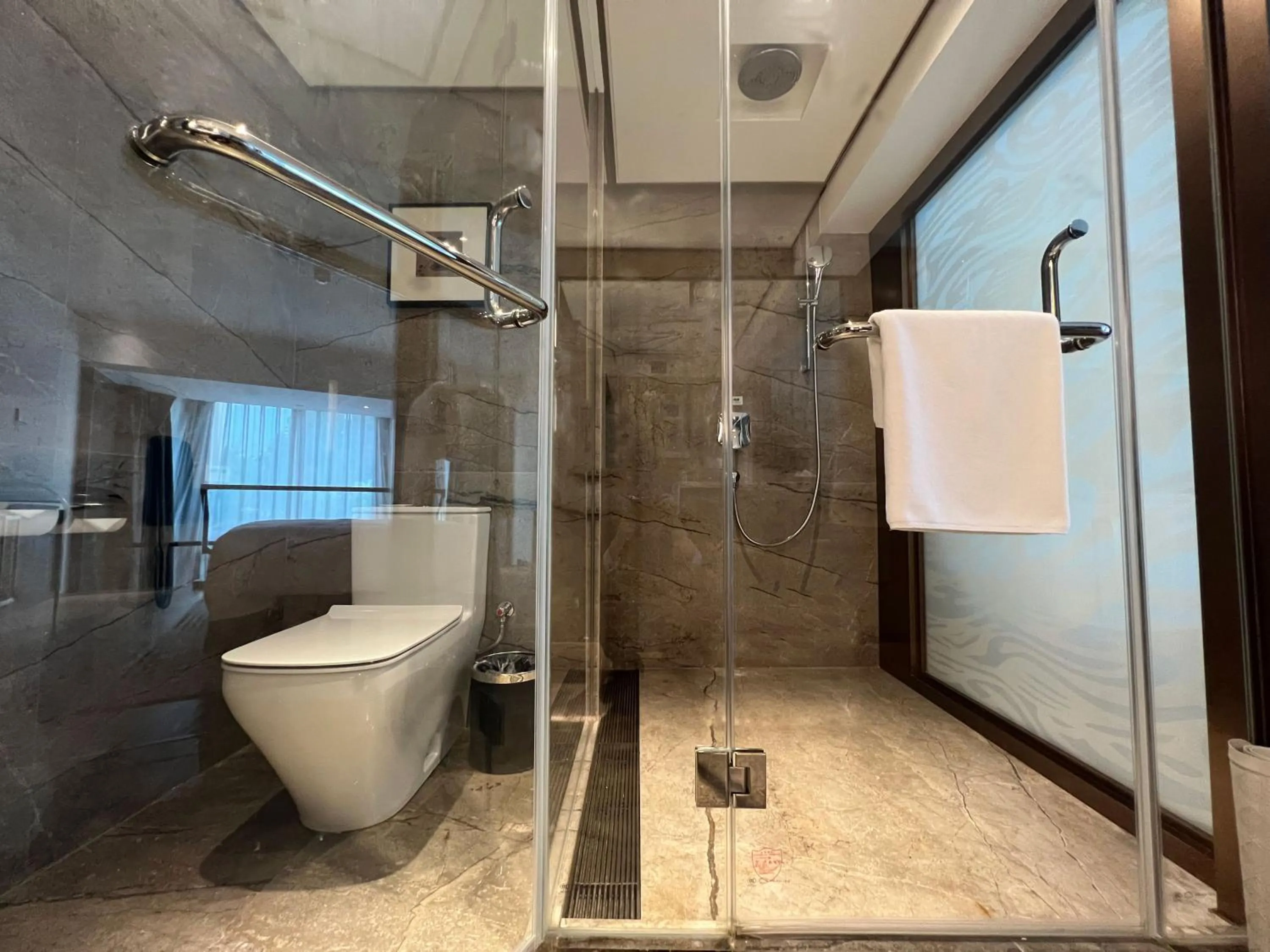Toilet in Holiday Inn Zhengzhou Zhongzhou by IHG