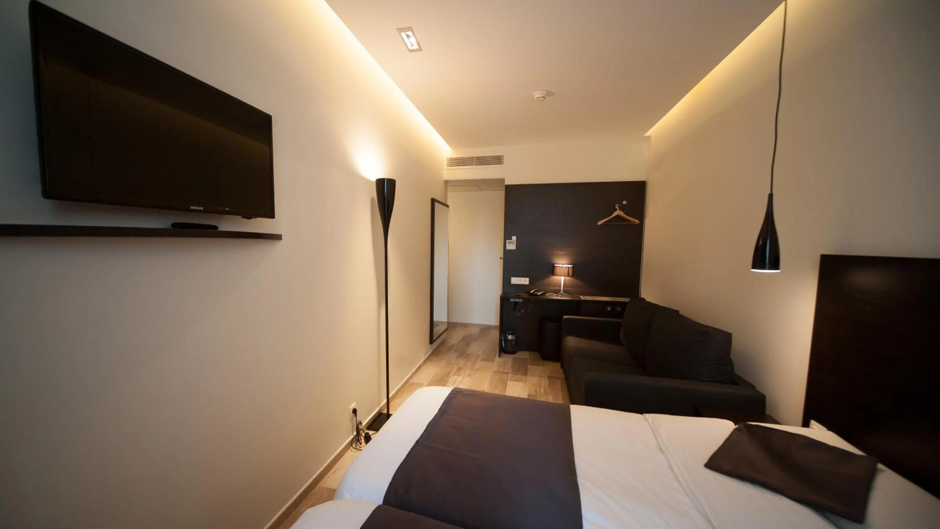 Photo of the whole room, Bed in Central Hotel