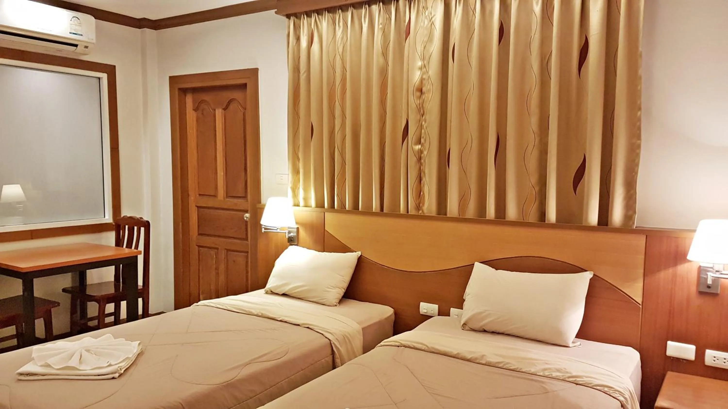 Bed in Green Harbor Hotel & Service Apartment