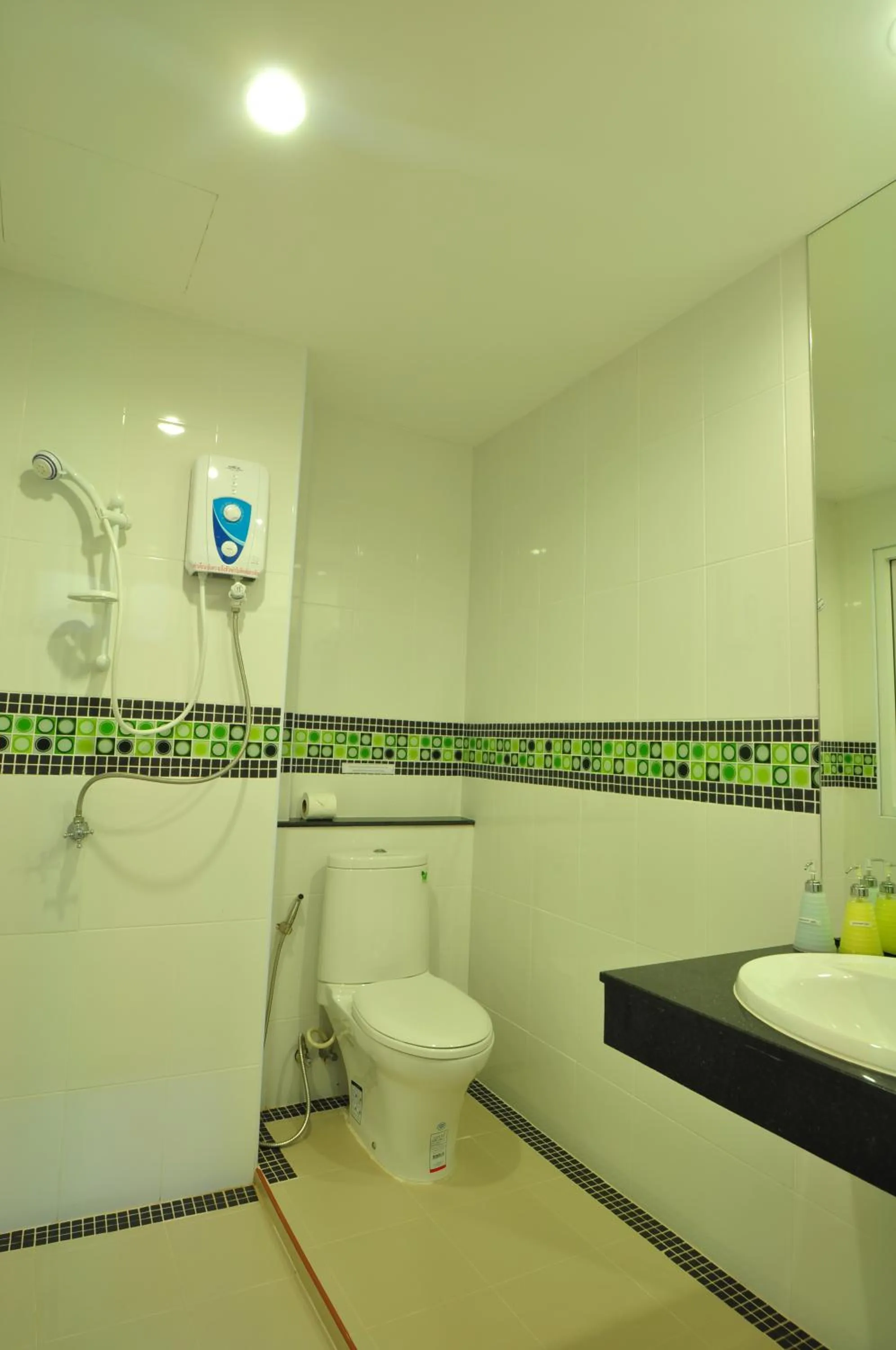 Shower in Green Harbor Hotel & Service Apartment