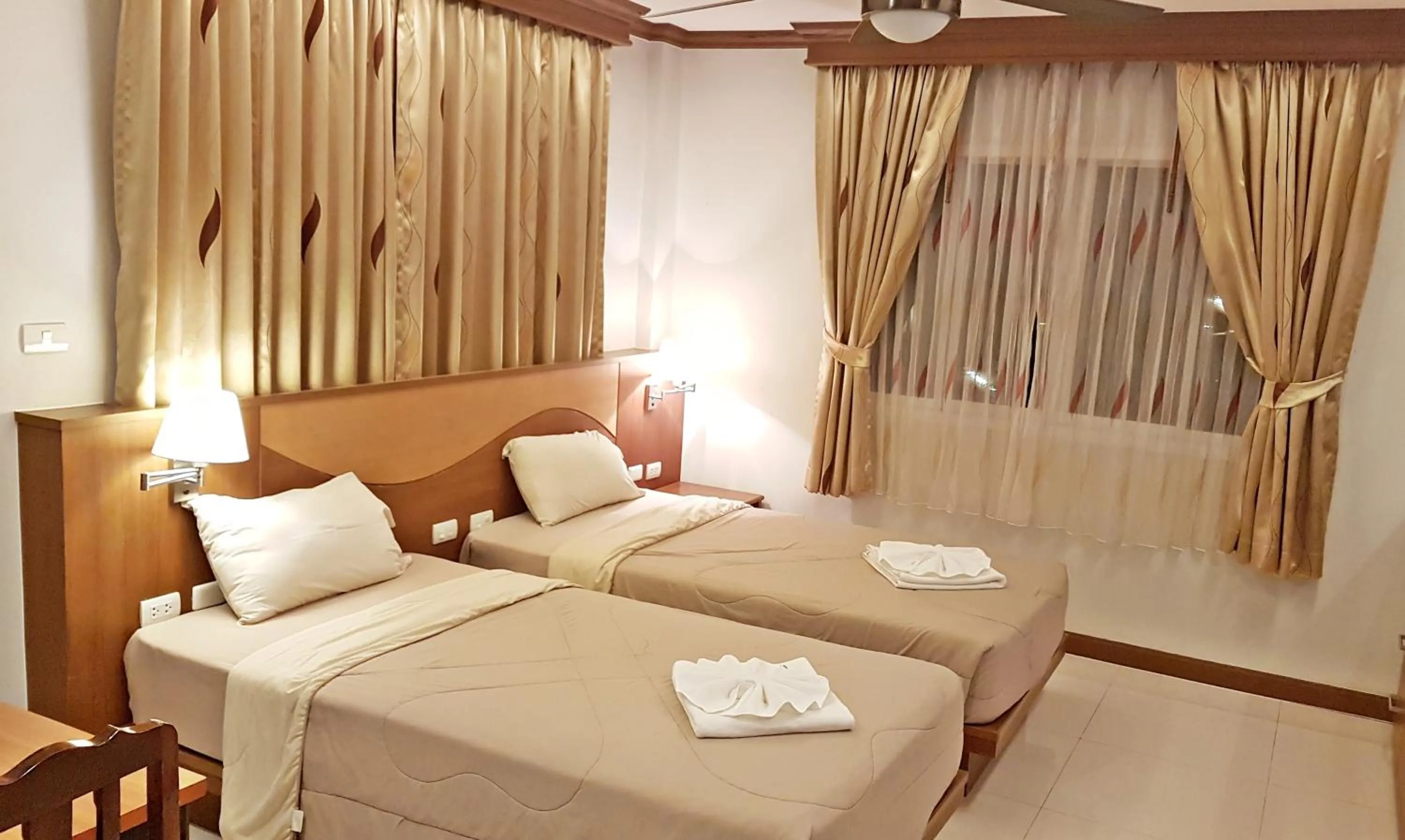 Bed in Green Harbor Hotel & Service Apartment