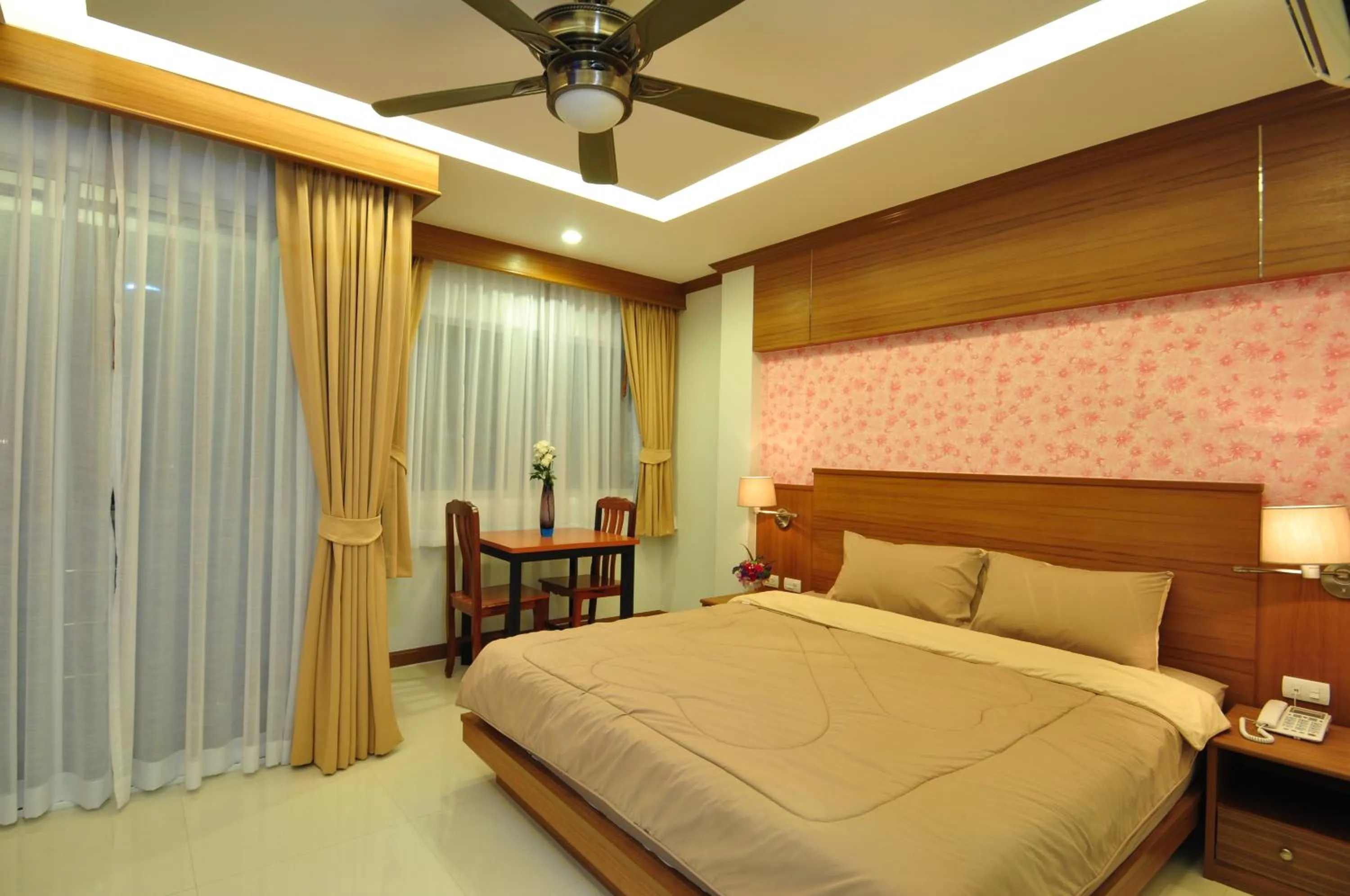 Bed in Green Harbor Hotel & Service Apartment
