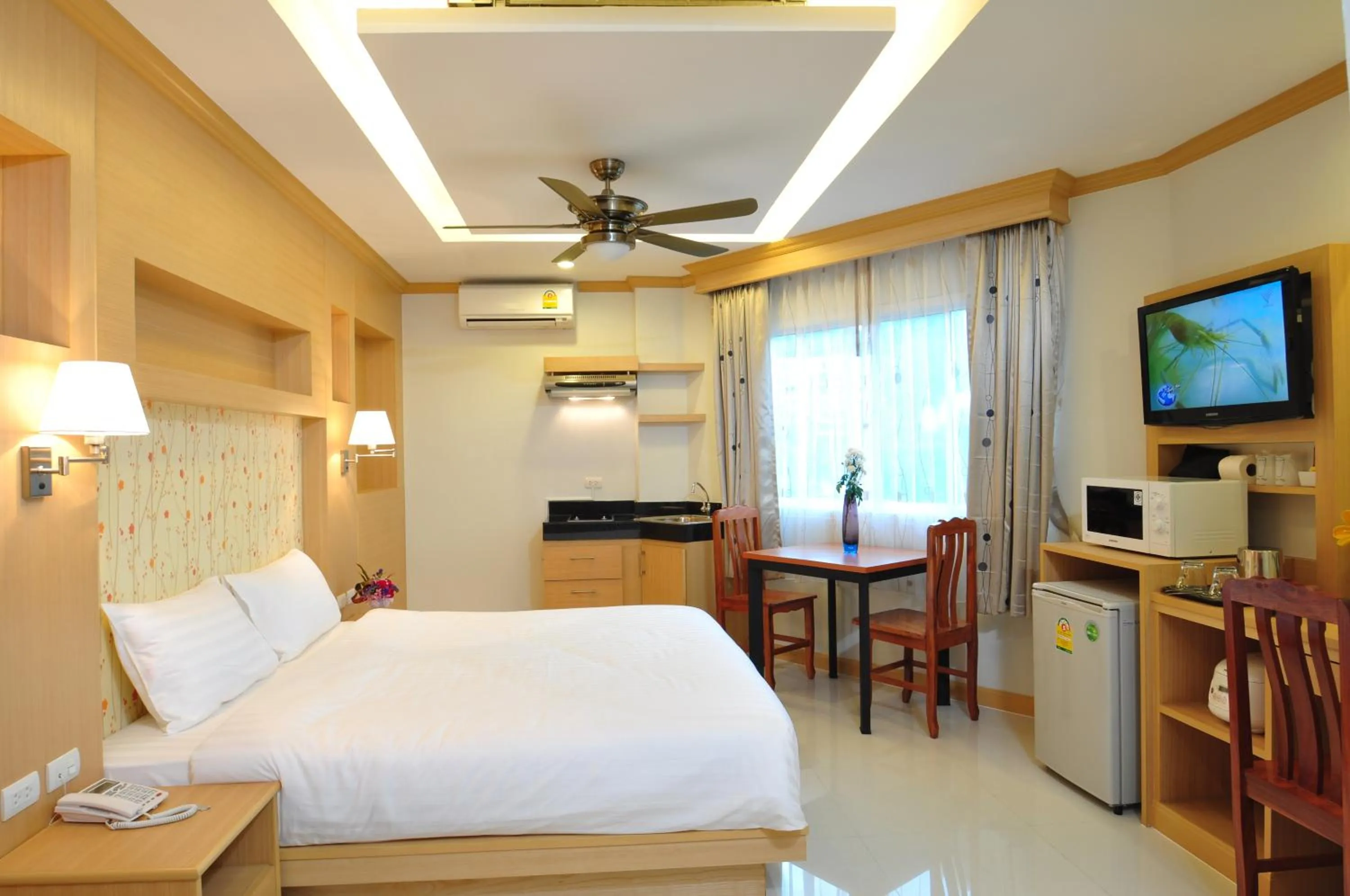 Bedroom, Bed in Green Harbor Hotel & Service Apartment