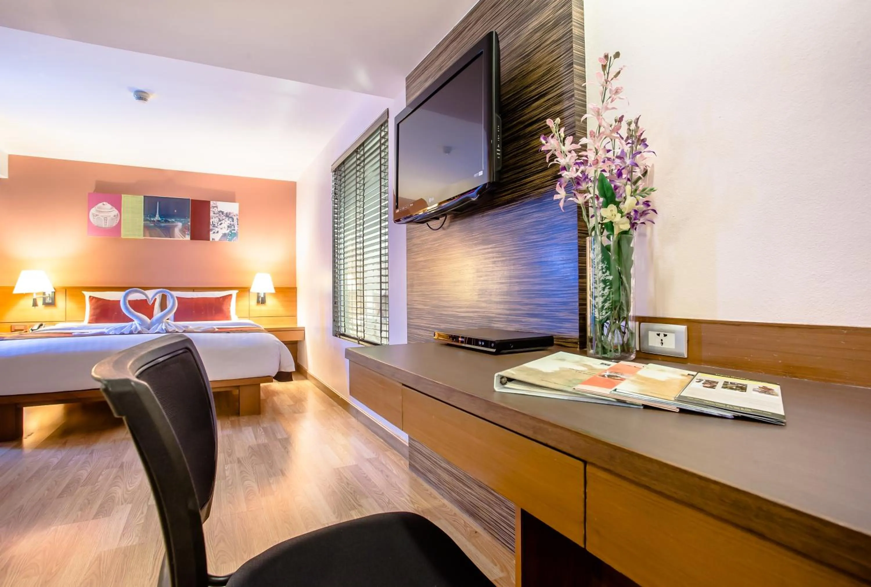 Seating area, Bed in Nouvo City Hotel