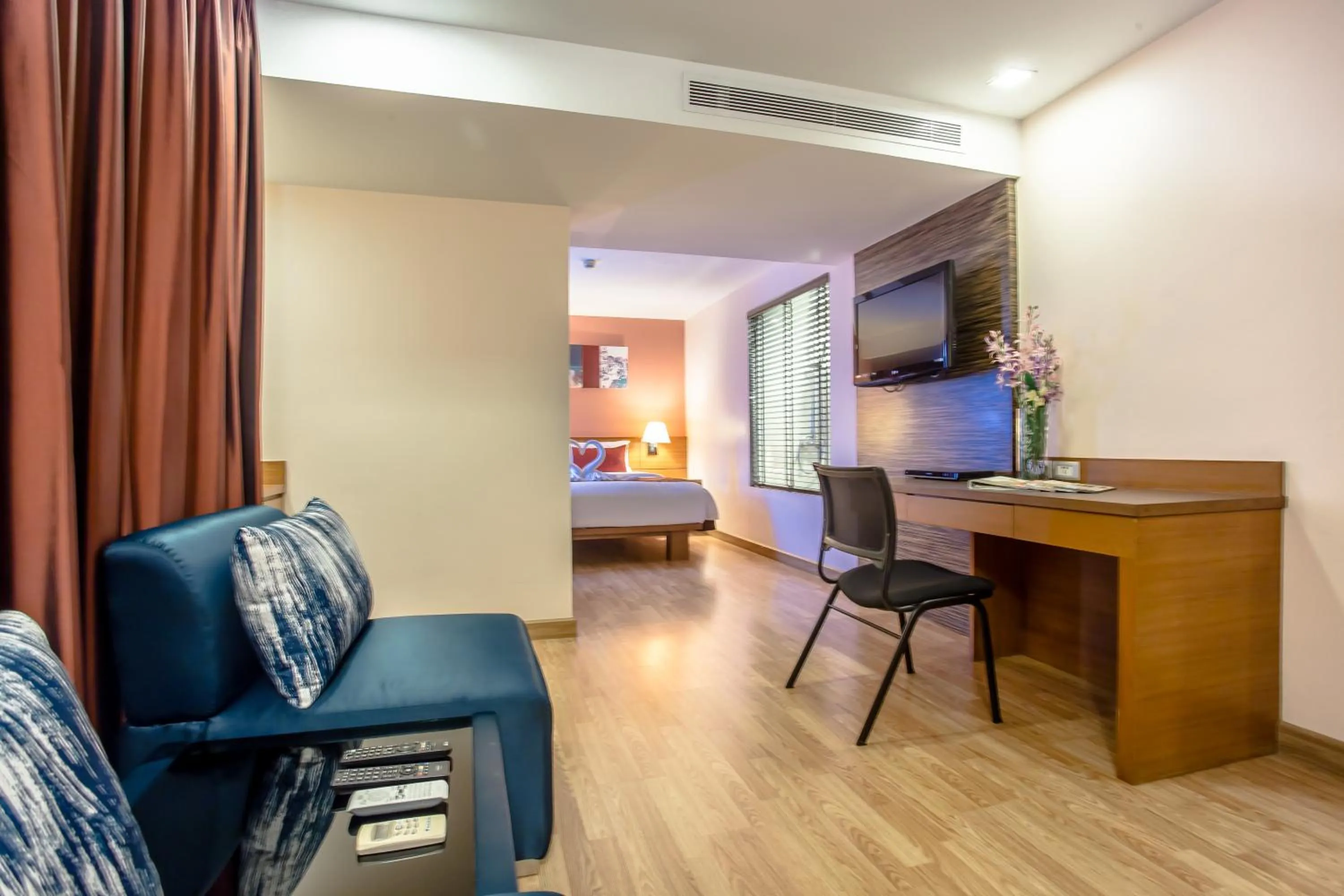 Seating area, Bed in Nouvo City Hotel