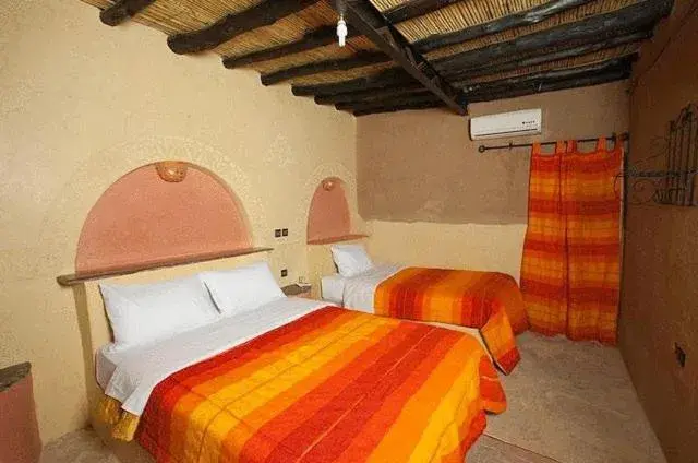 Bed in Palmeras Y Dunas Luxery Camp Bed in Palmeras Y Dunas Luxery Camp