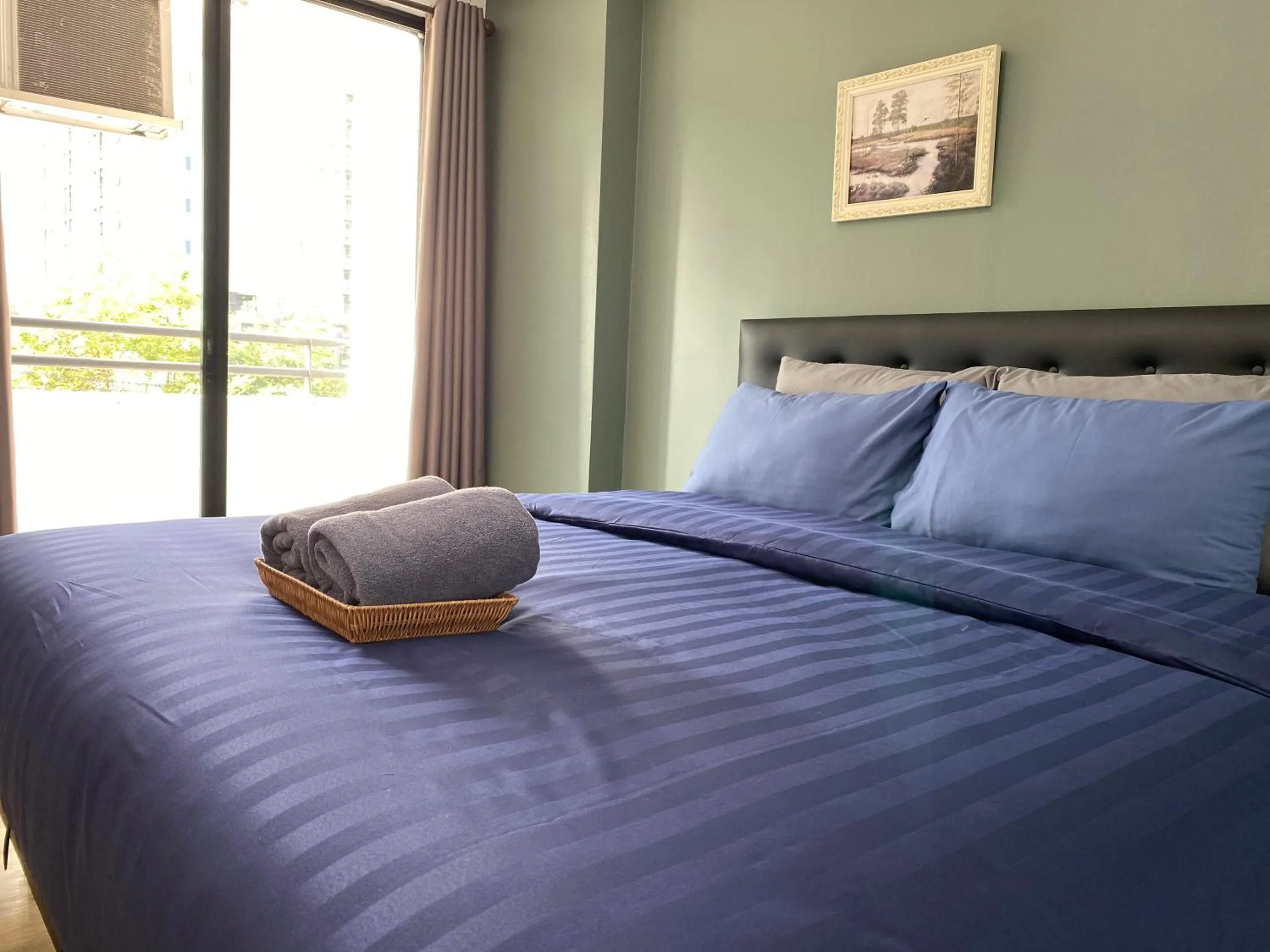 Bed in Baansuay Rattanathibet Apartment