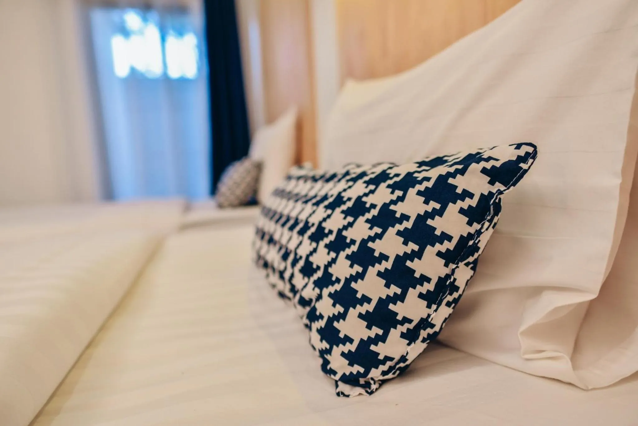 Bed in The Cozy Hotel