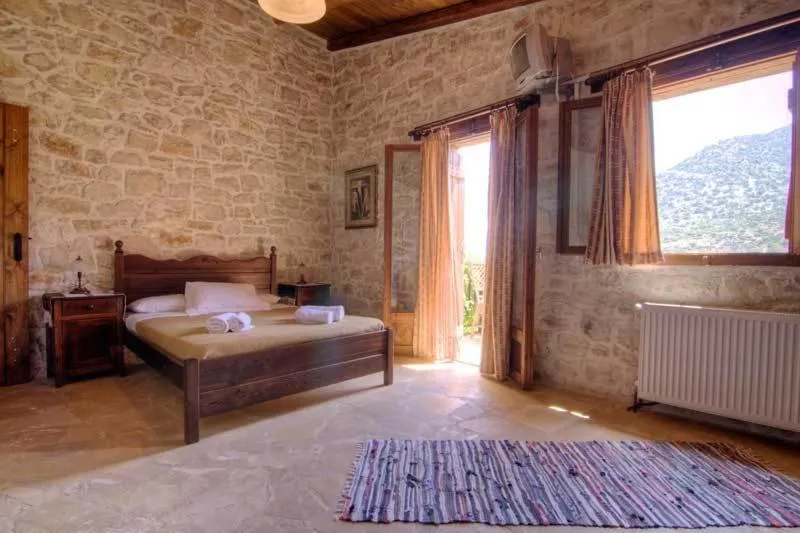 Bed in Stone Village Hotel Apartments