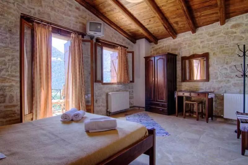 Bed in Stone Village Hotel Apartments