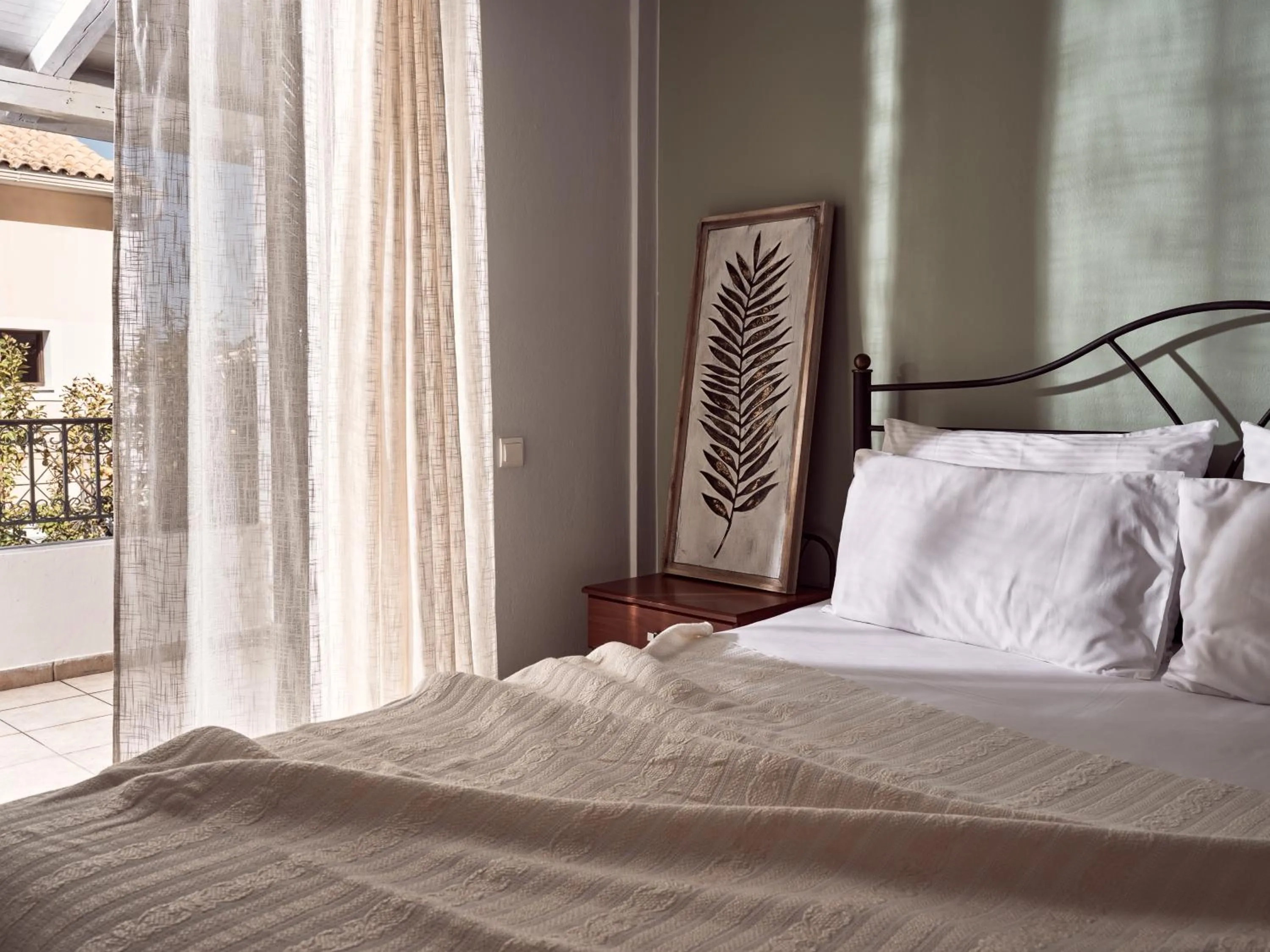 Bed in Razis Apartments