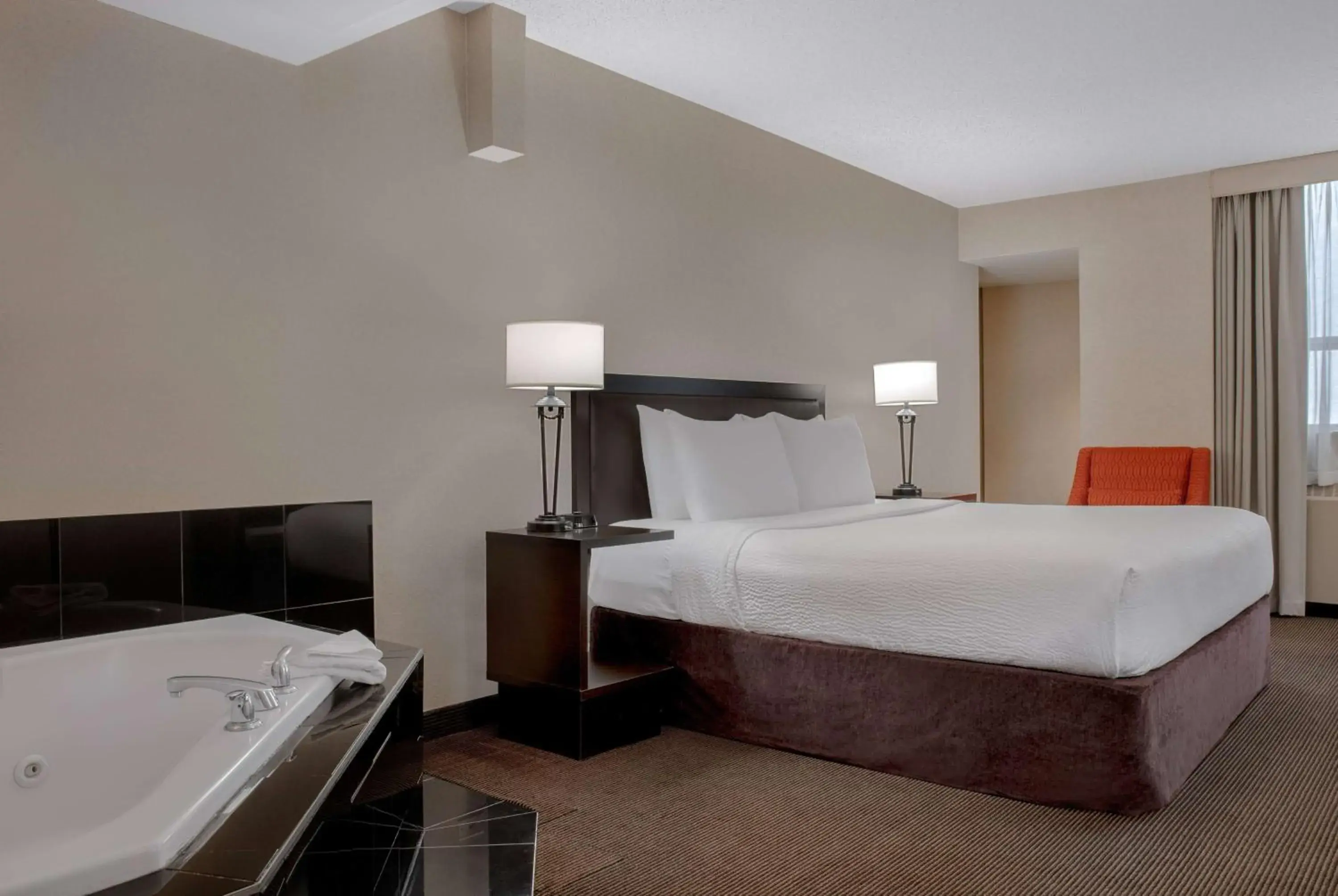 Photo of the whole room, Bed in Ramada Plaza by Wyndham Calgary Downtown Photo of the whole room, Bed in Ramada Plaza by Wyndham Calgary Downtown