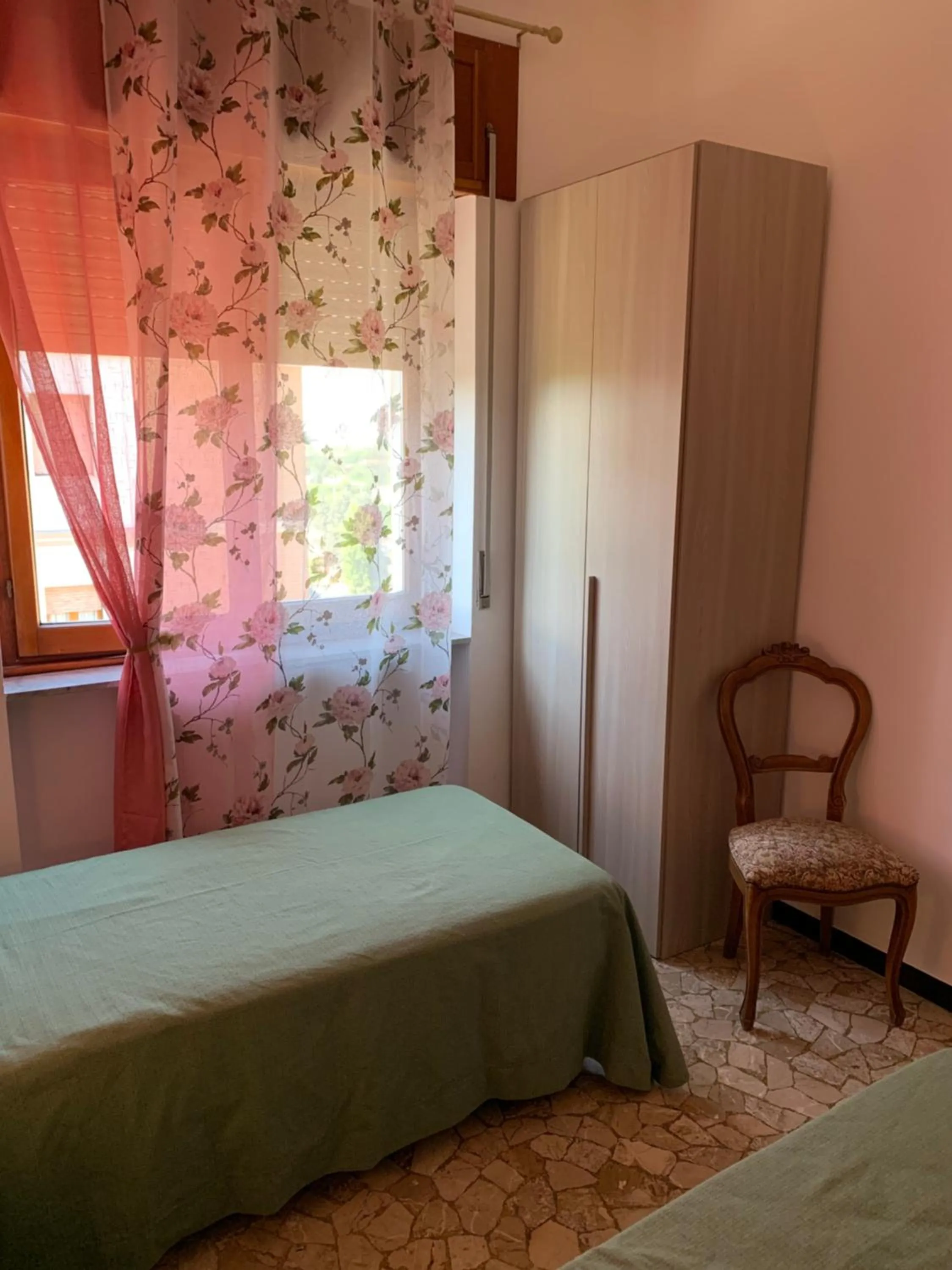 Bedroom in Affittacamere Serravalle Shopping