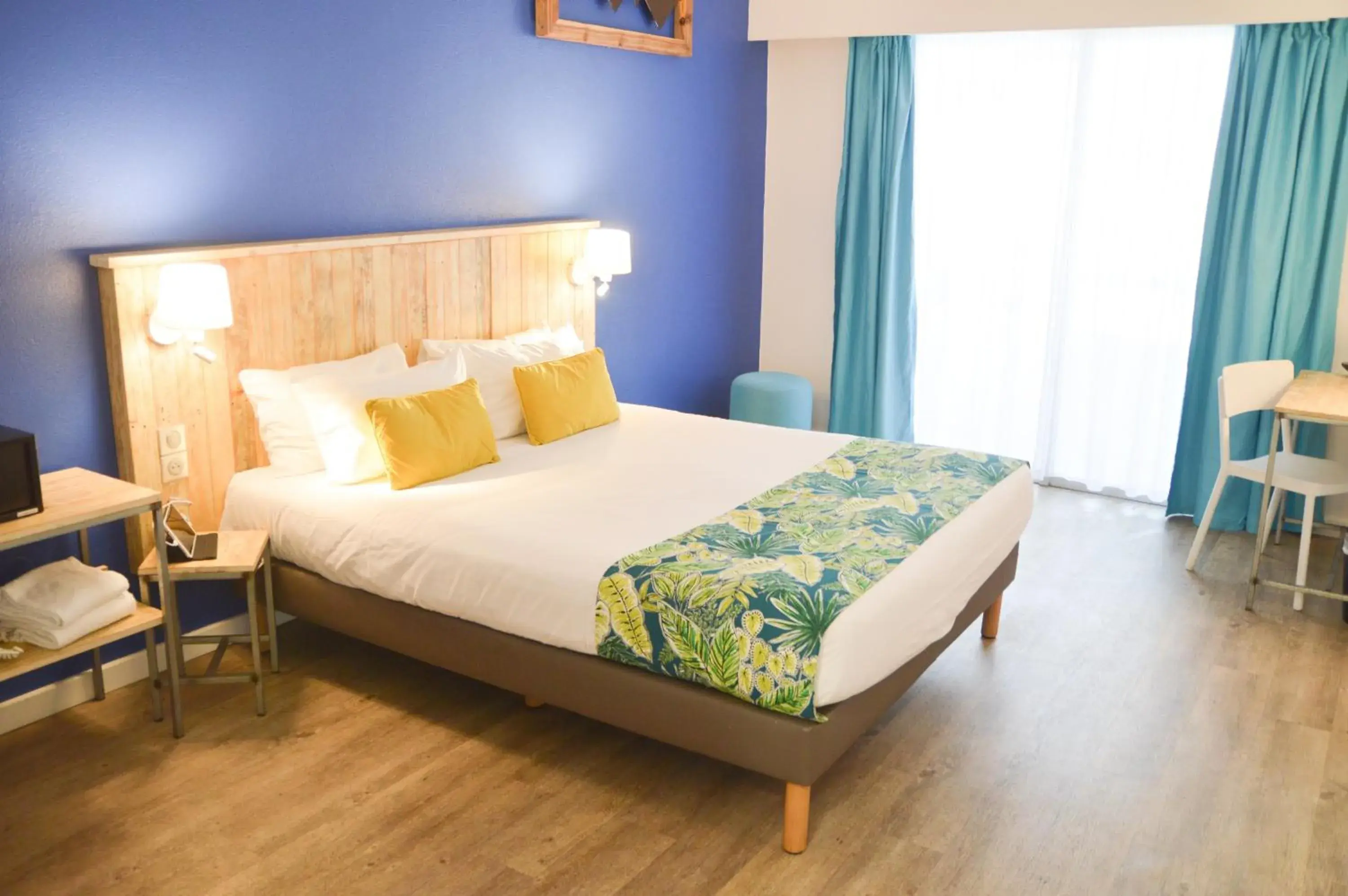 Bed in Hôtel Le Grand Bleu Bed in Hôtel Le Grand Bleu