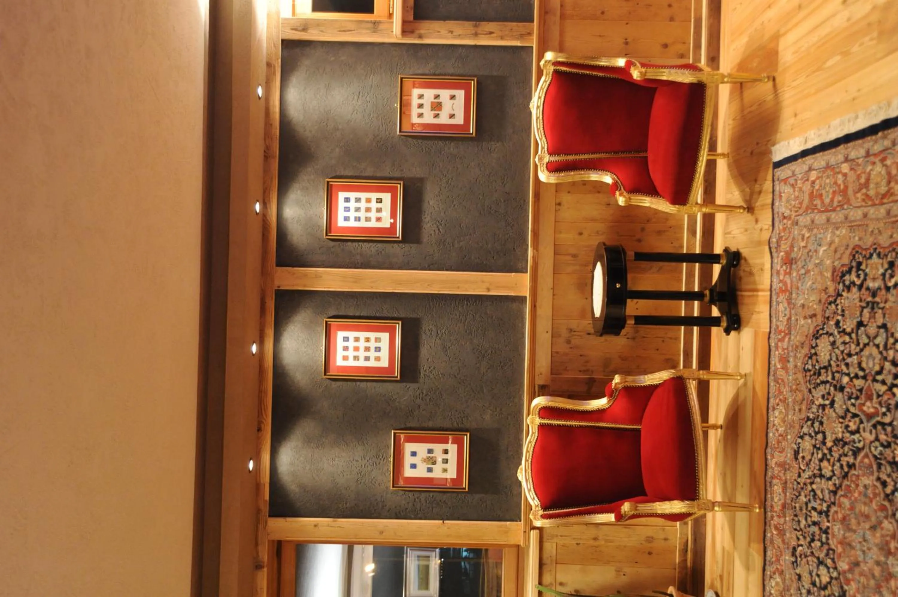 Communal lounge/ TV room in Laghetto Alpine Hotel & Restaurant